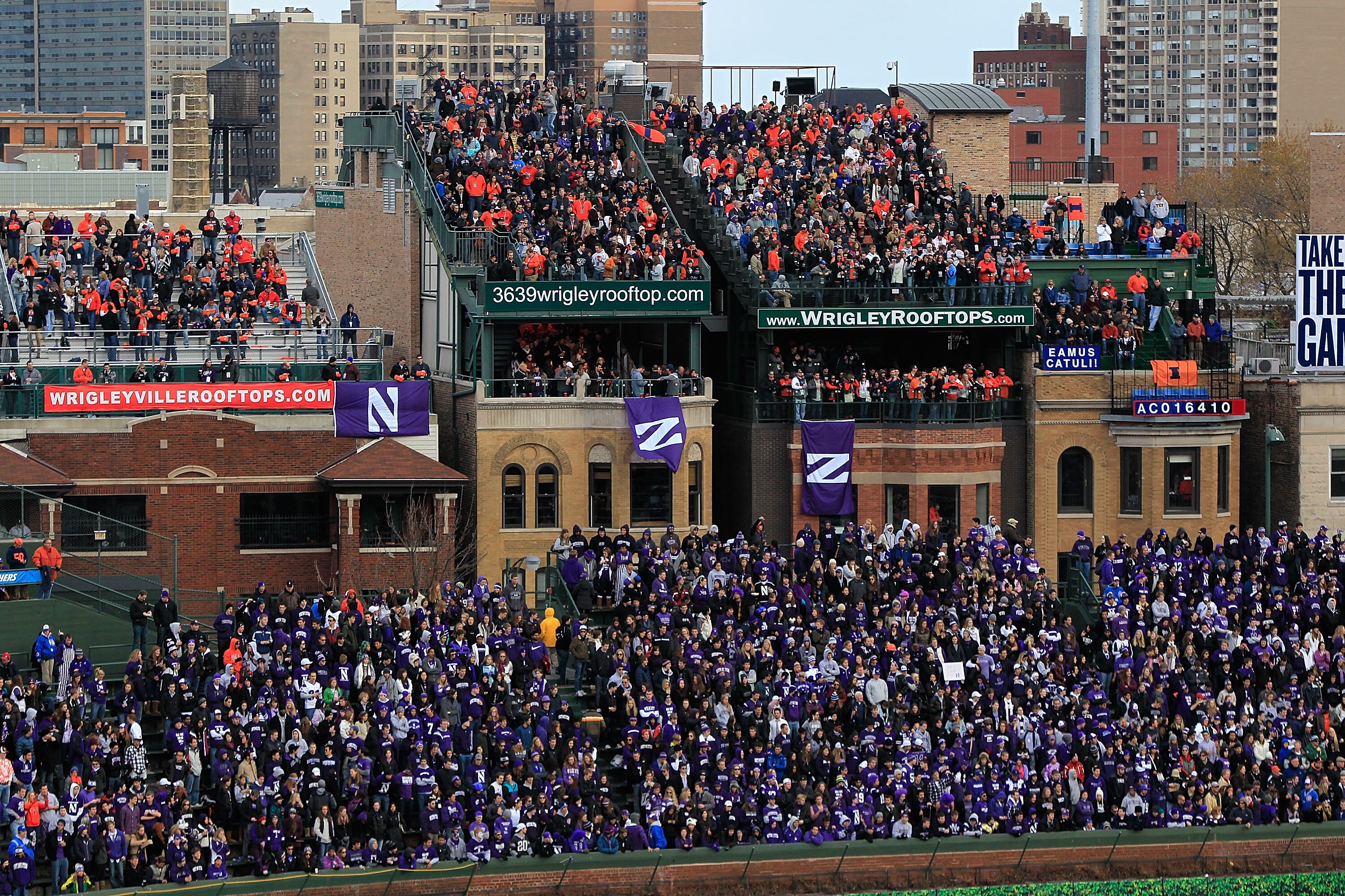 CHICAGO - NOVEMBER 20: Fans pack the right field bleachers and the roof tops to watch as the Northwestern Wildcats take on the Illinois Fighting Illini during a game played at Wrigley Field on November 20, 2010 in Chicago, Illinois. (Photo by Jonathan Dan