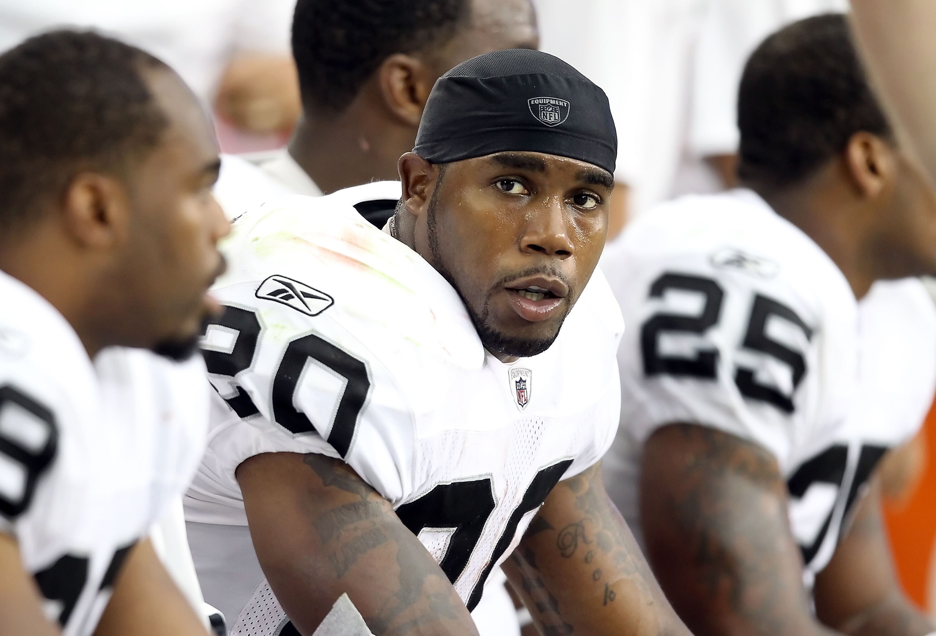 GLENDALE, AZ - SEPTEMBER 26:  Runningback Darren McFadden #20 of the Oakland Raiders sits on the sidelines during the NFL game against the Arizona Cardinals at the University of Phoenix Stadium on September 26, 2010 in Glendale, Arizona.  The Cardinals de