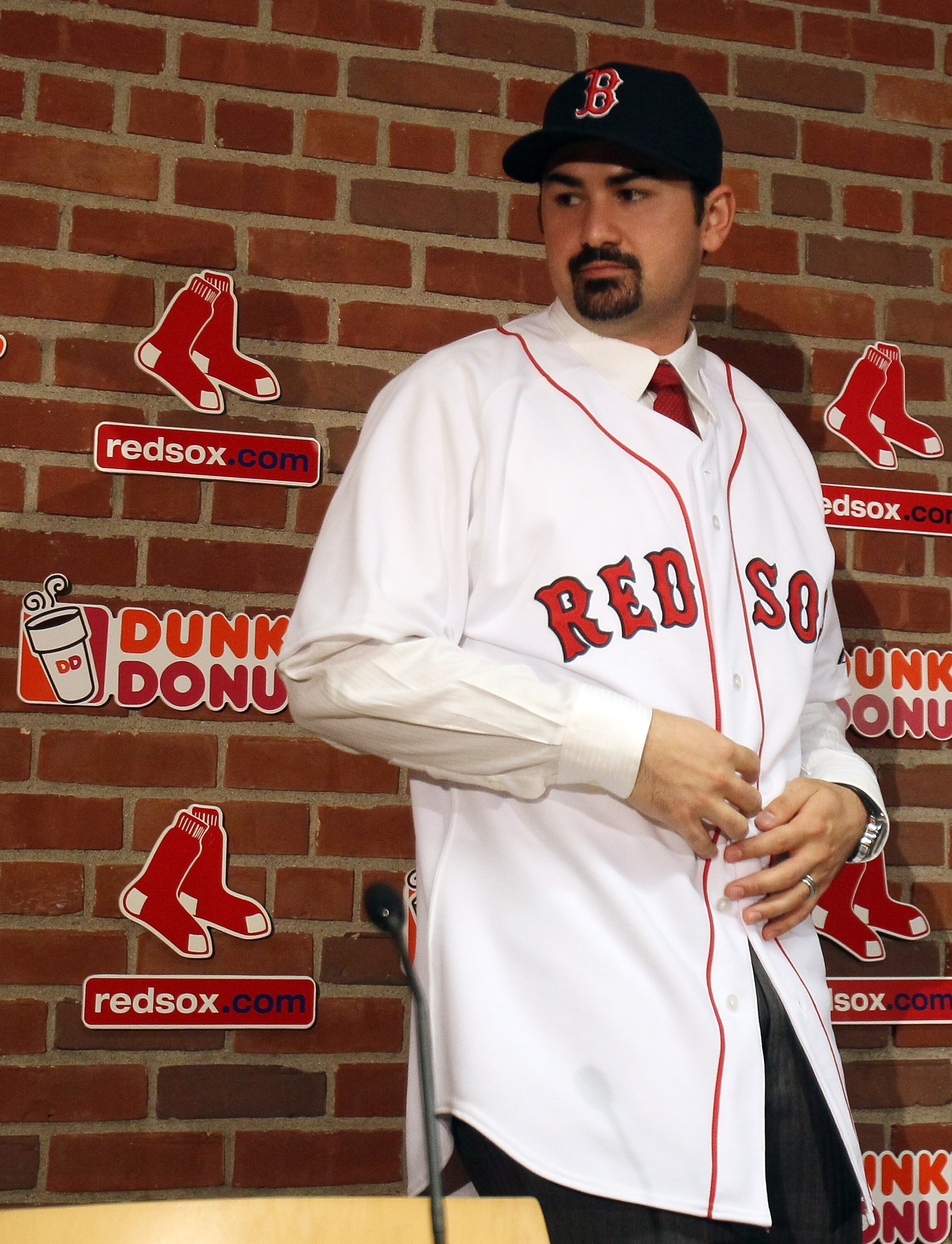 BOSTON, MA - DECEMBER 06:  Adrian Gonzalez stands after a press conference to announce his signing with the Boston Red Sox on December 6,  2010 at the Fenway Park in Boston, Massachusetts.  (Photo by Elsa/Getty Images)