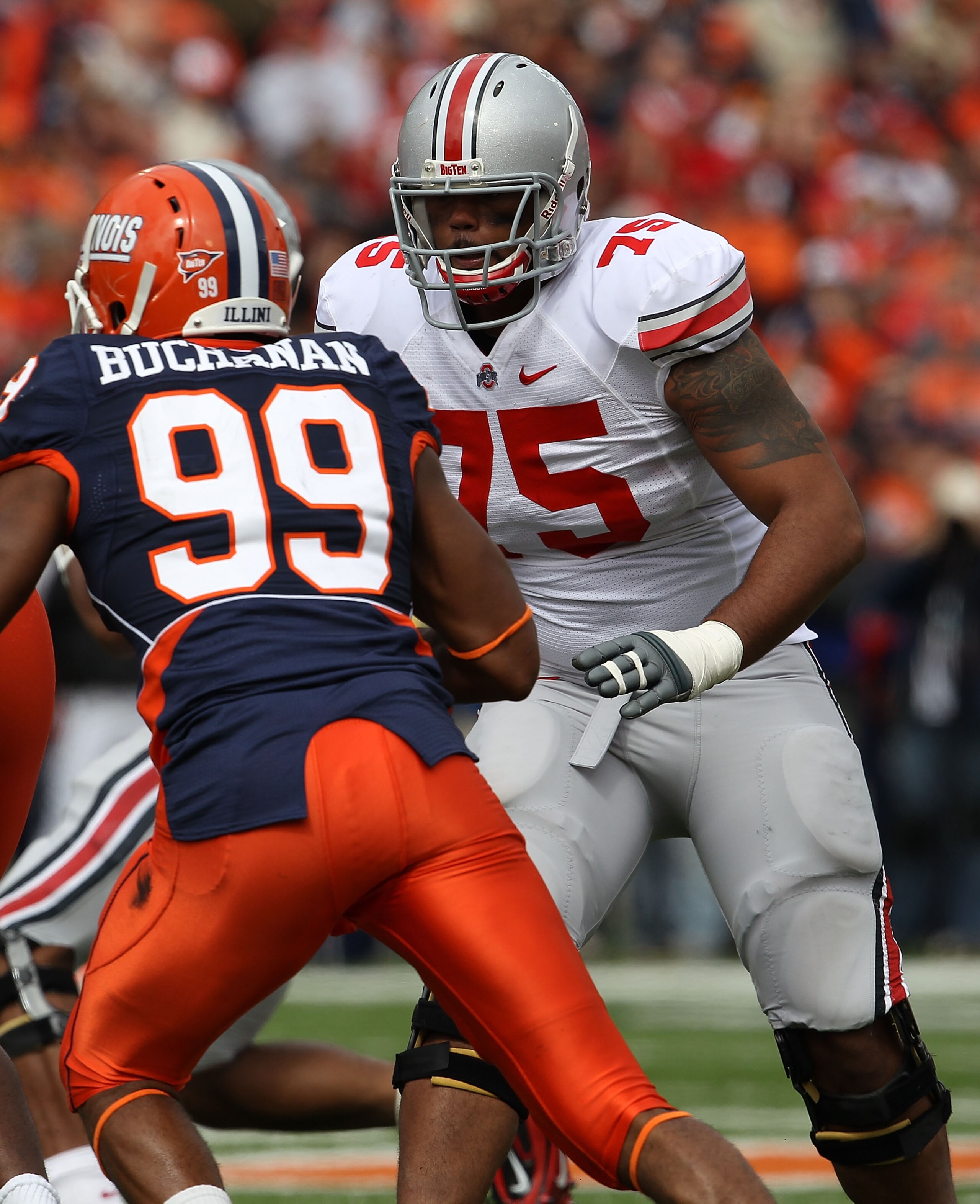 CHAMPAIGN, IL - OCTOBER 02: Mike Adams #75 of the Ohio State Buckeyes prepares to block Michael Buchanan #99 of the Illinois Fighting Illini at Memorial Stadium on October 2, 2010 in Champaign, Illinois. Ohio State defeated Illinois 24-13. (Photo by Jonat