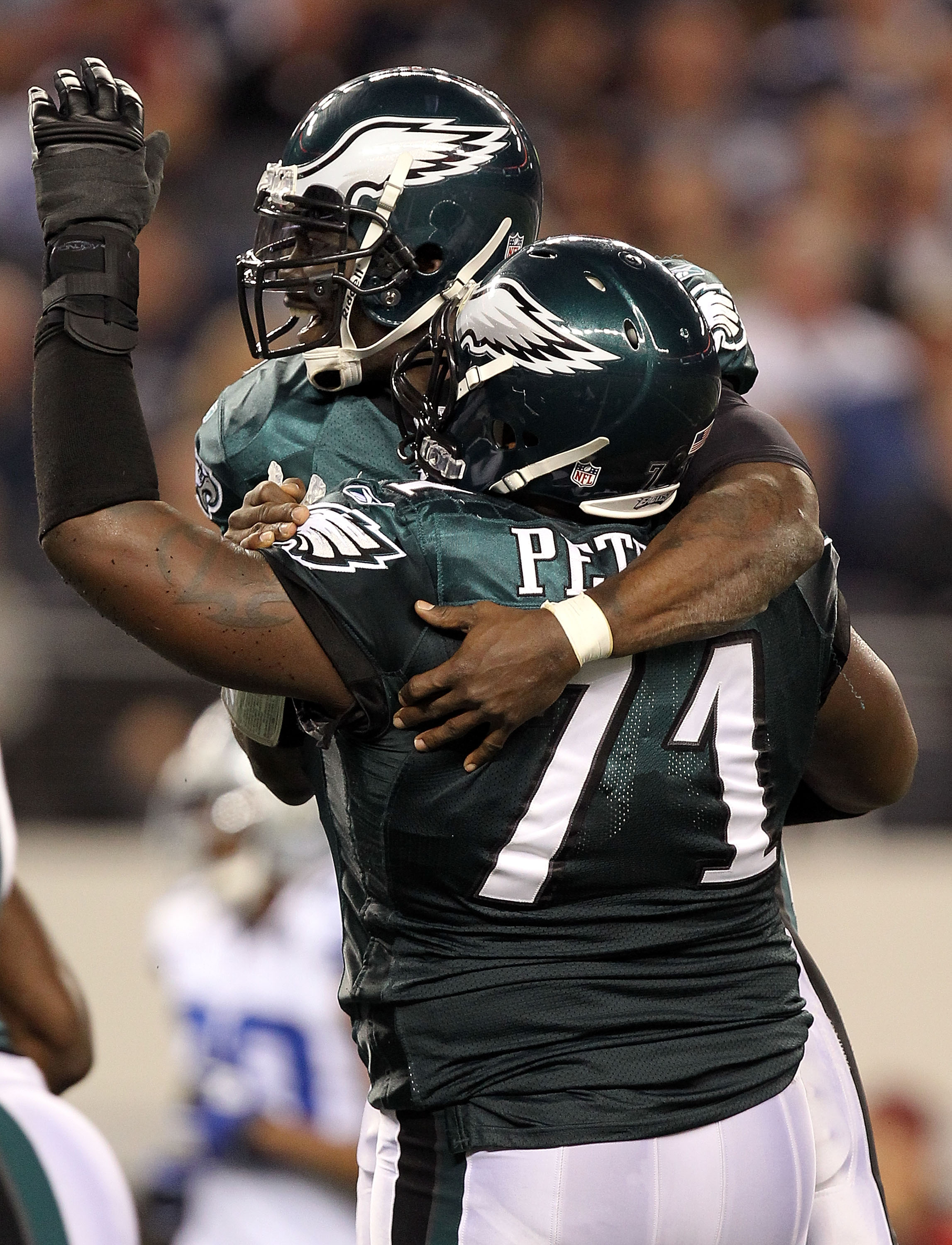 ARLINGTON, TX - DECEMBER 12:  Quarterback Michael Vick #7 of the Philadelphia Eagles celebrates a touchdown with Jason Peters #71 in the second quarter against the Dallas Cowboys at Cowboys Stadium on December 12, 2010 in Arlington, Texas.  (Photo by Rona