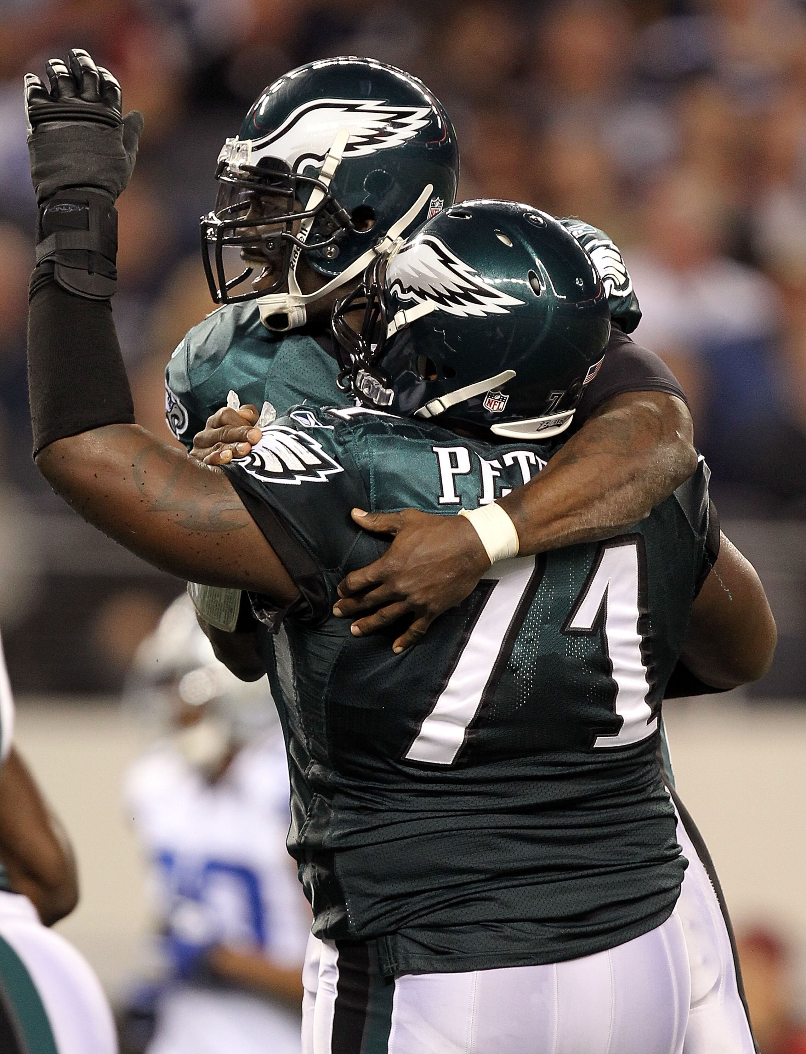 ARLINGTON, TX - DECEMBER 12:  Quarterback Michael Vick #7 of the Philadelphia Eagles celebrates a touchdown with Jason Peters #71 in the second quarter against the Dallas Cowboys at Cowboys Stadium on December 12, 2010 in Arlington, Texas.  (Photo by Rona