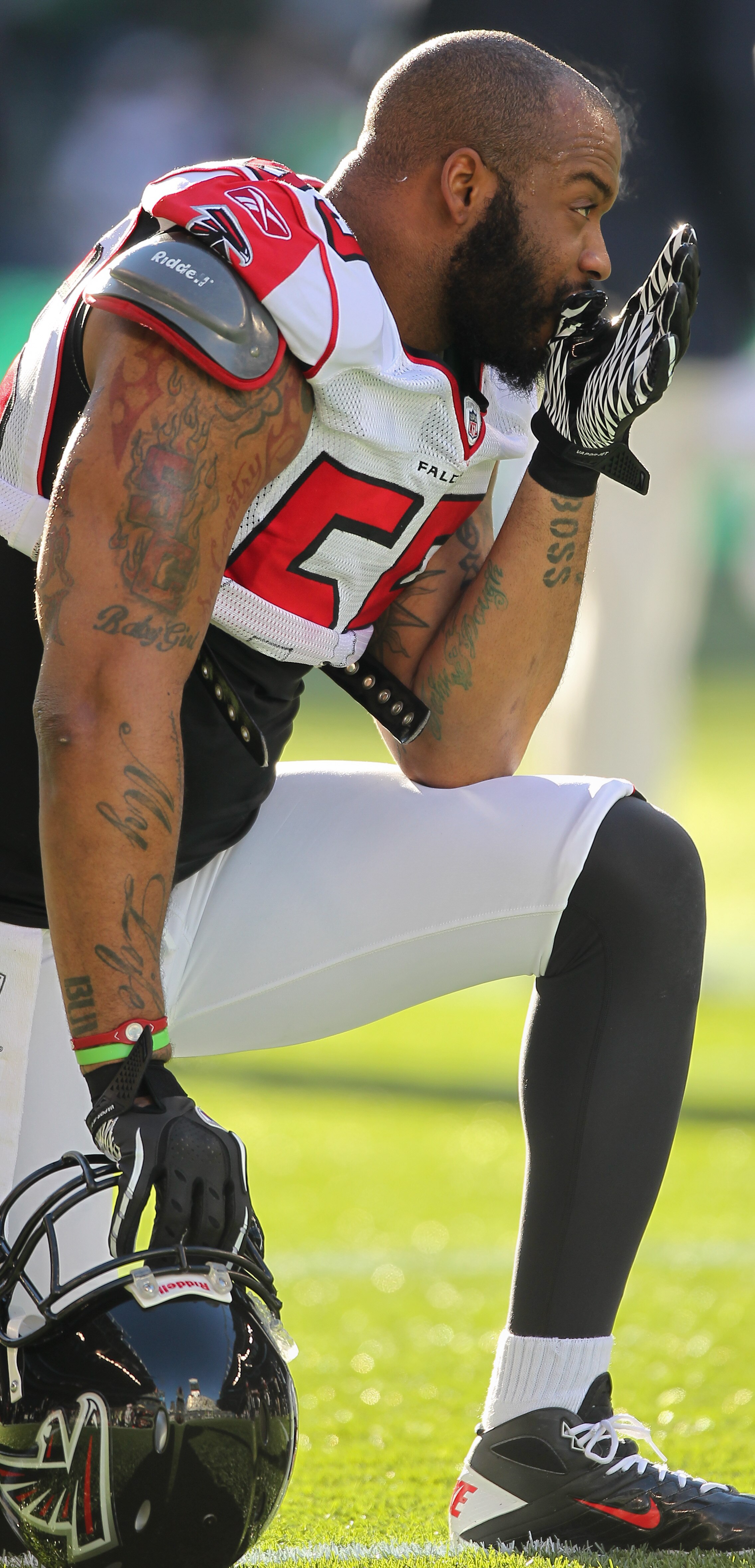 SEATTLE, WA - DECEMBER 19:  Defensive end John Abraham #55 of the Atlanta Falcons looks on during warmups prior to the game against the Seattle Seahawks at Qwest Field on December 19, 2010 in Seattle, Washington. (Photo by Otto Greule Jr/Getty Images)