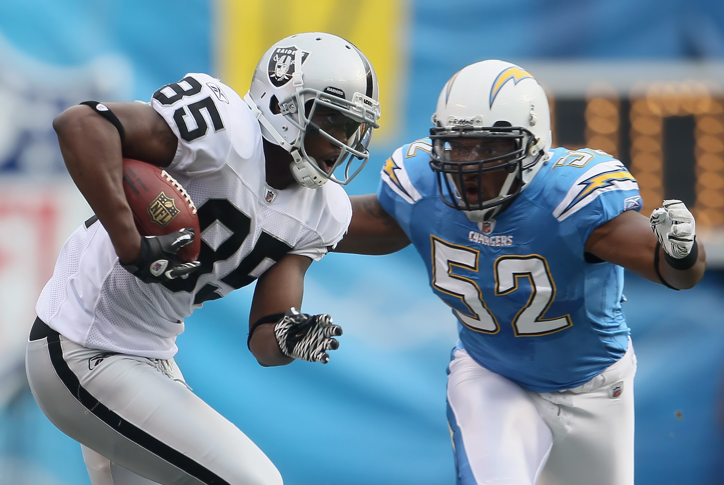 SAN DIEGO - DECEMBER 05:  Darrius Heyward-Bey #85 of the Oakland Raiders is pursued by Larry English #52 of the San Diego Chargers in the second quarter at Qualcomm Stadium on December 5, 2010 in San Diego, California. The Raiders defeated the Chargers 28
