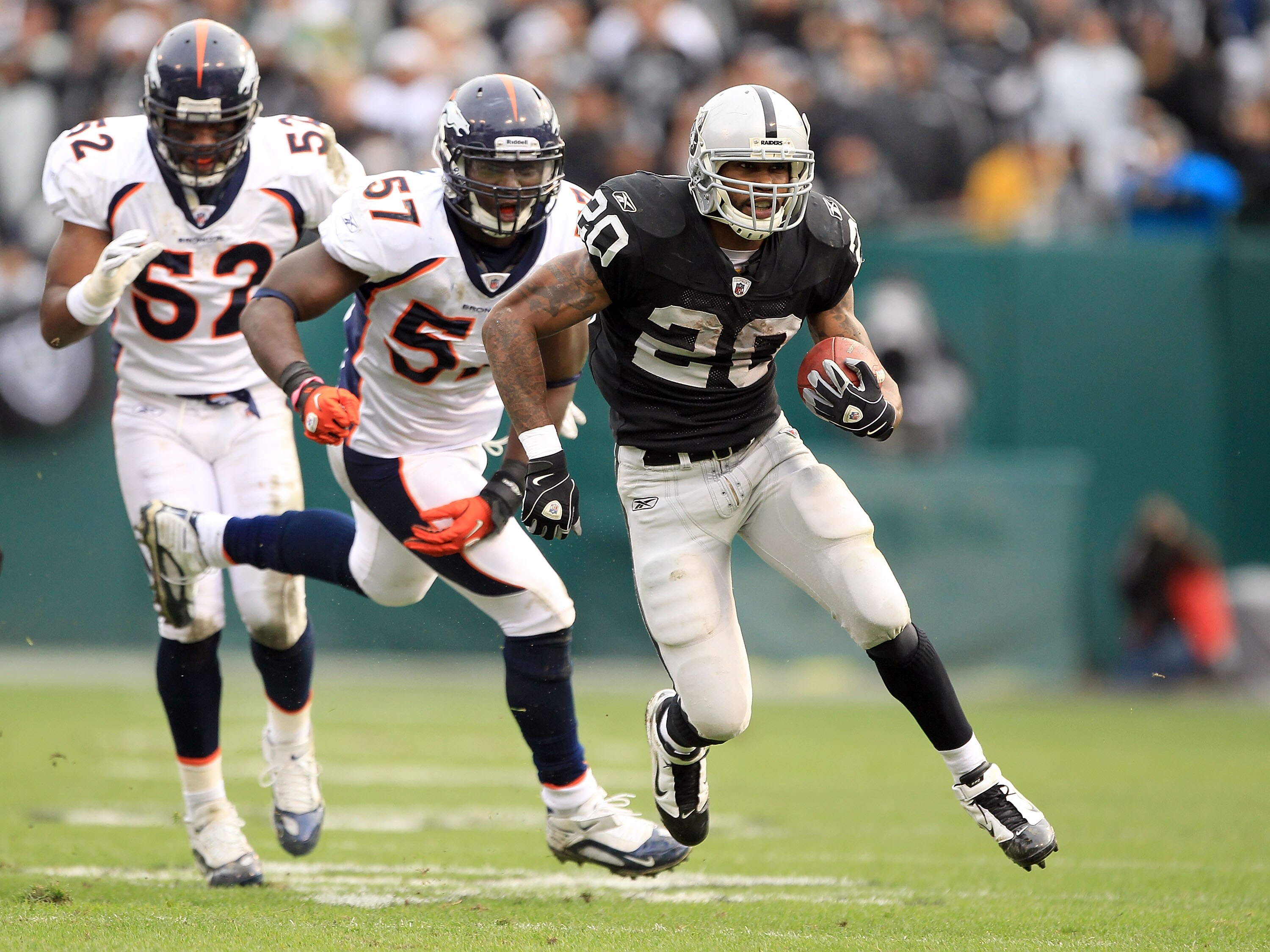 OAKLAND, CA - DECEMBER 19:  Darren McFadden #20 of the Oakland Raiders runs with the ball during their game against the Denver Broncos at Oakland-Alameda County Coliseum on December 19, 2010 in Oakland, California.  (Photo by Ezra Shaw/Getty Images)