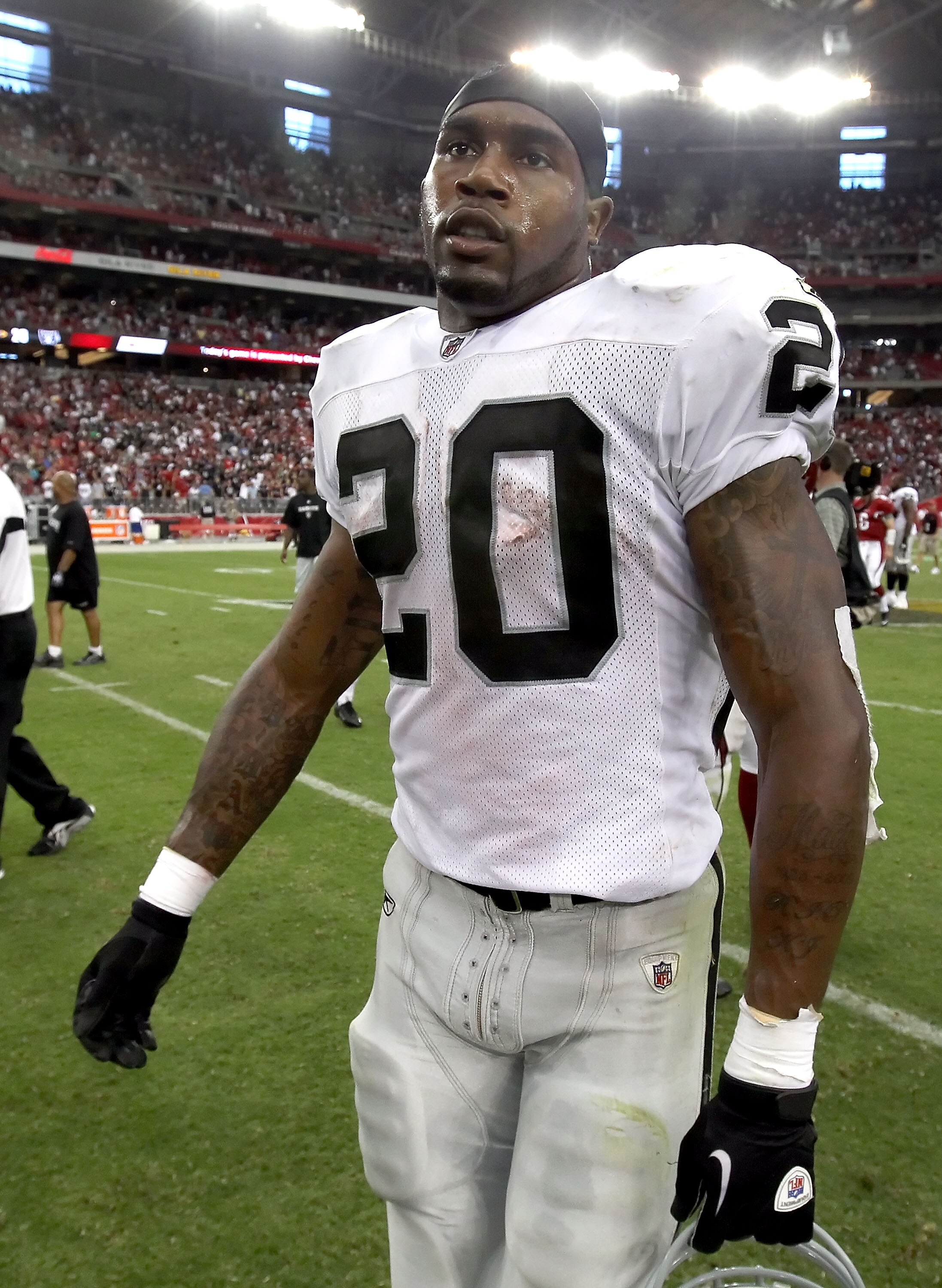 GLENDALE, AZ - SEPTEMBER 26:  Runningback Darren McFadden #20 of the Oakland Raiders walks off the field after being defeated by the Arizona Cardinals in the NFL game at the University of Phoenix Stadium on September 26, 2010 in Glendale, Arizona. The Car