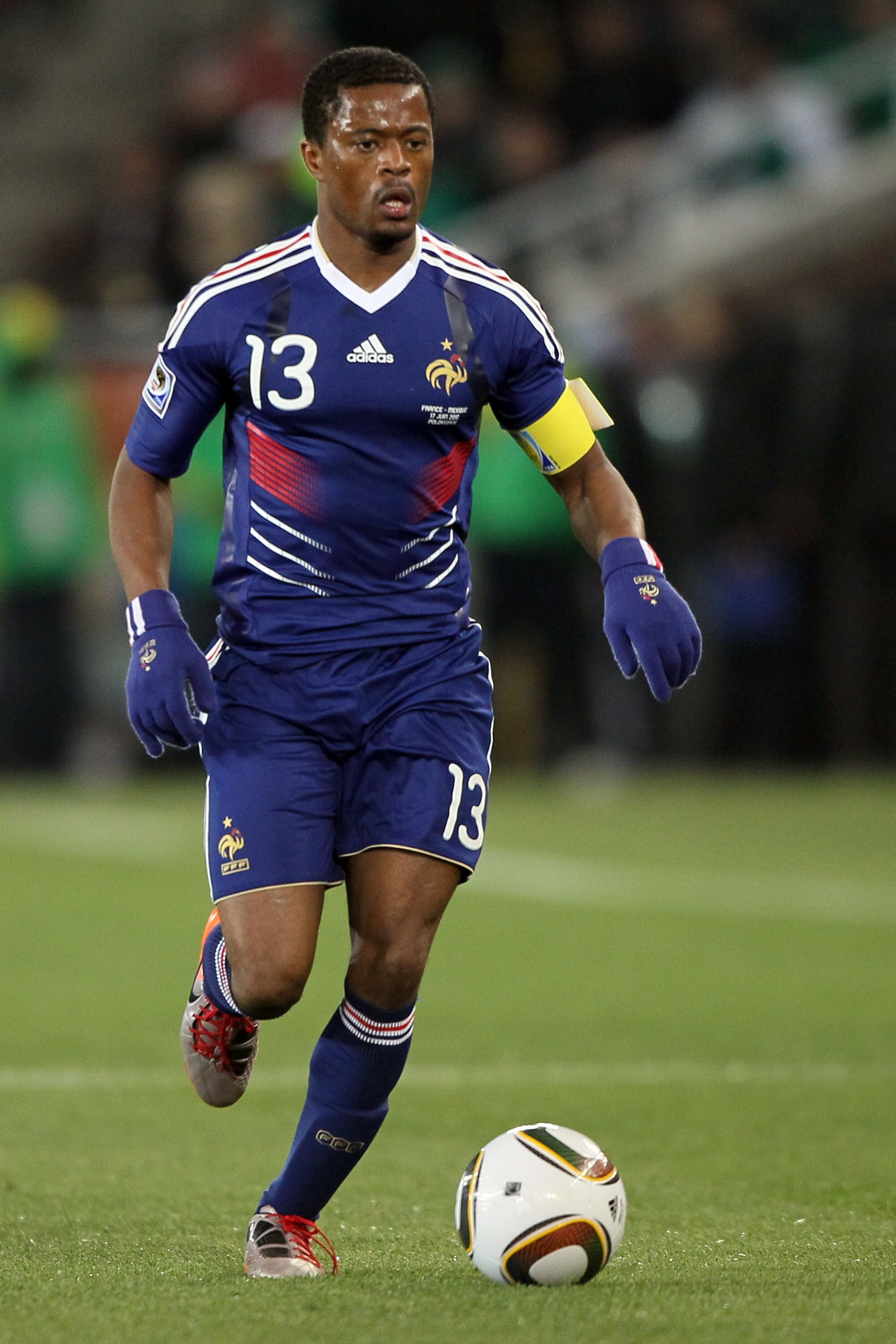 POLOKWANE, SOUTH AFRICA - JUNE 17:  Patrice Evra of France runs with the ball during the 2010 FIFA World Cup South Africa Group A match between France and Mexico at the Peter Mokaba Stadium on June 17, 2010 in Polokwane, South Africa.  (Photo by Christof