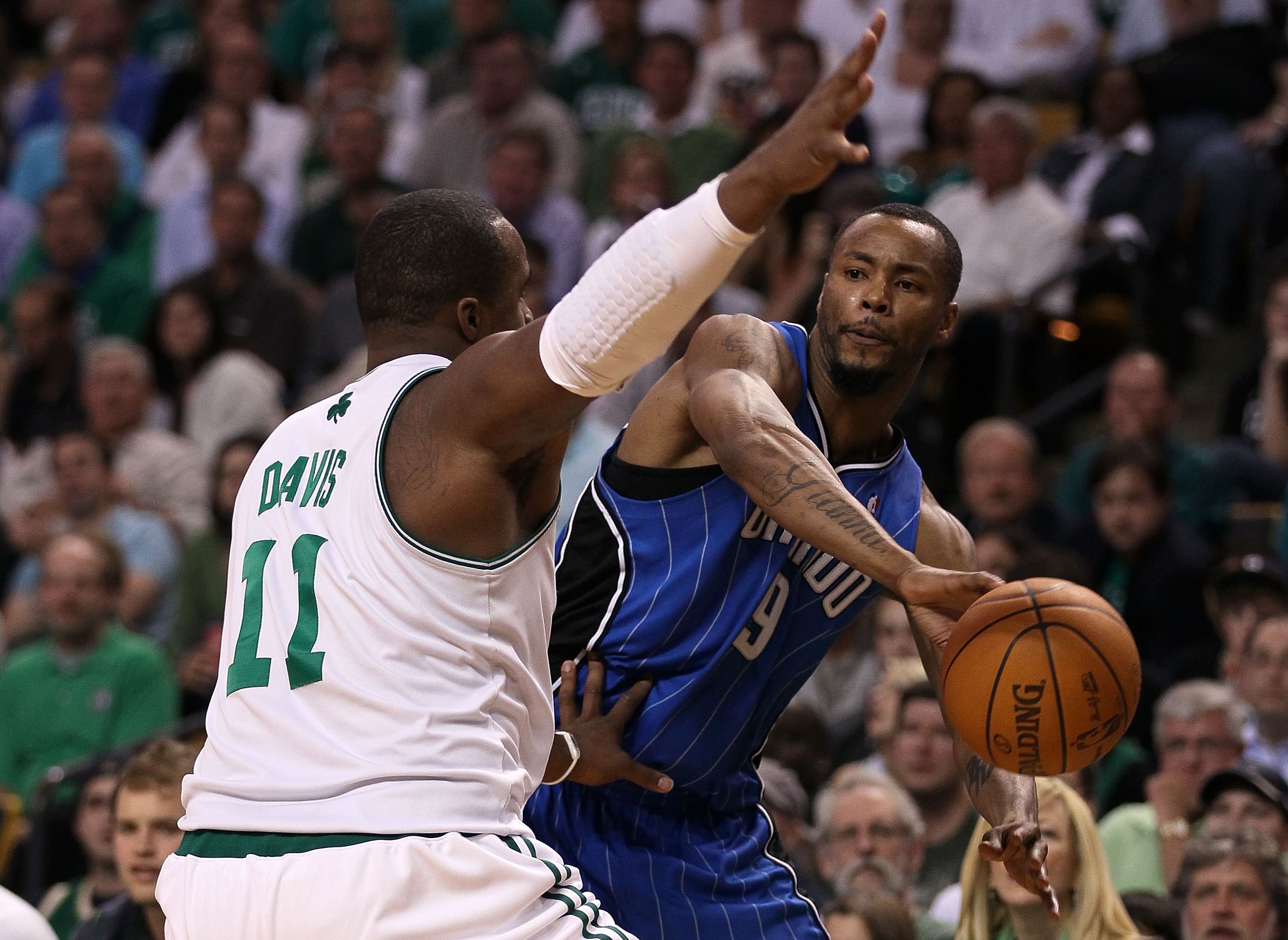 BOSTON - MAY 28:  Rashard Lewis #9 of the Orlando Magic looks to pass the ball against Glen Davis #11 of the Boston Celtics in Game Six of the Eastern Conference Finals during the 2010 NBA Playoffs at TD Garden on May 28, 2010 in Boston, Massachusetts.  N