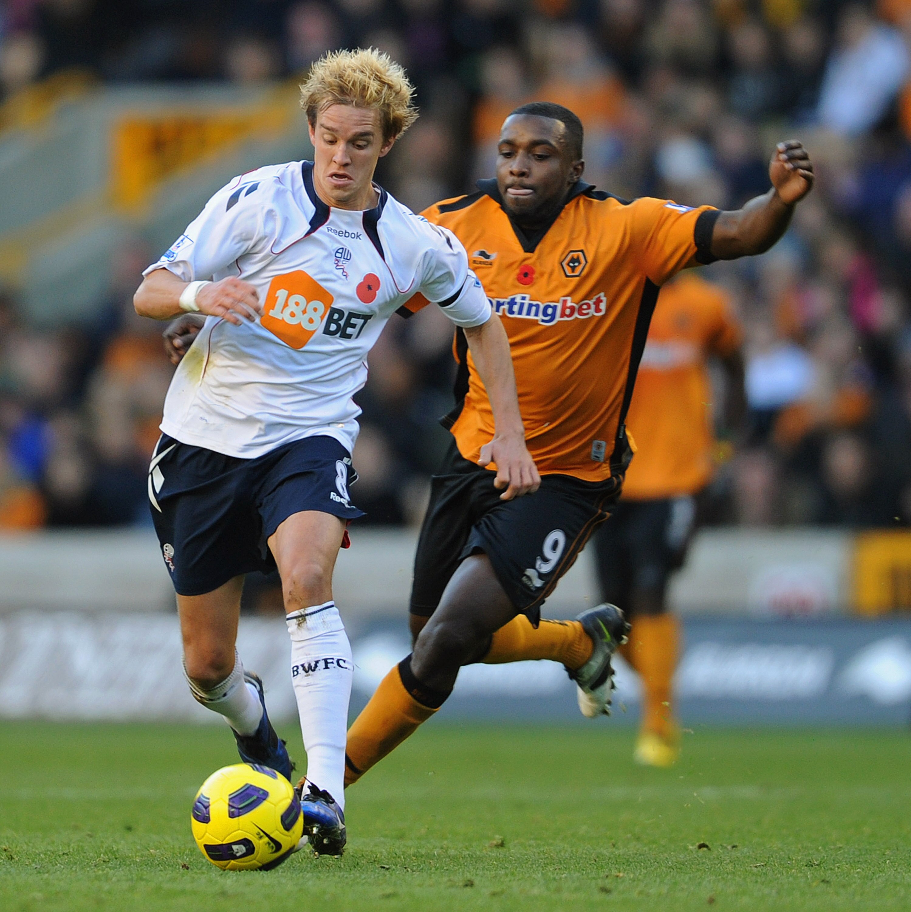 WOLVERHAMPTON, ENGLAND - NOVEMBER 13:  Sylvan Ebanks-Blake of Wolves battles Stuart Holden of Bolton during the Barclays Premier League match between Wolverhampton Wanderers and Bolton Wanderers at Molineux on November 13, 2010 in Wolverhampton, England.