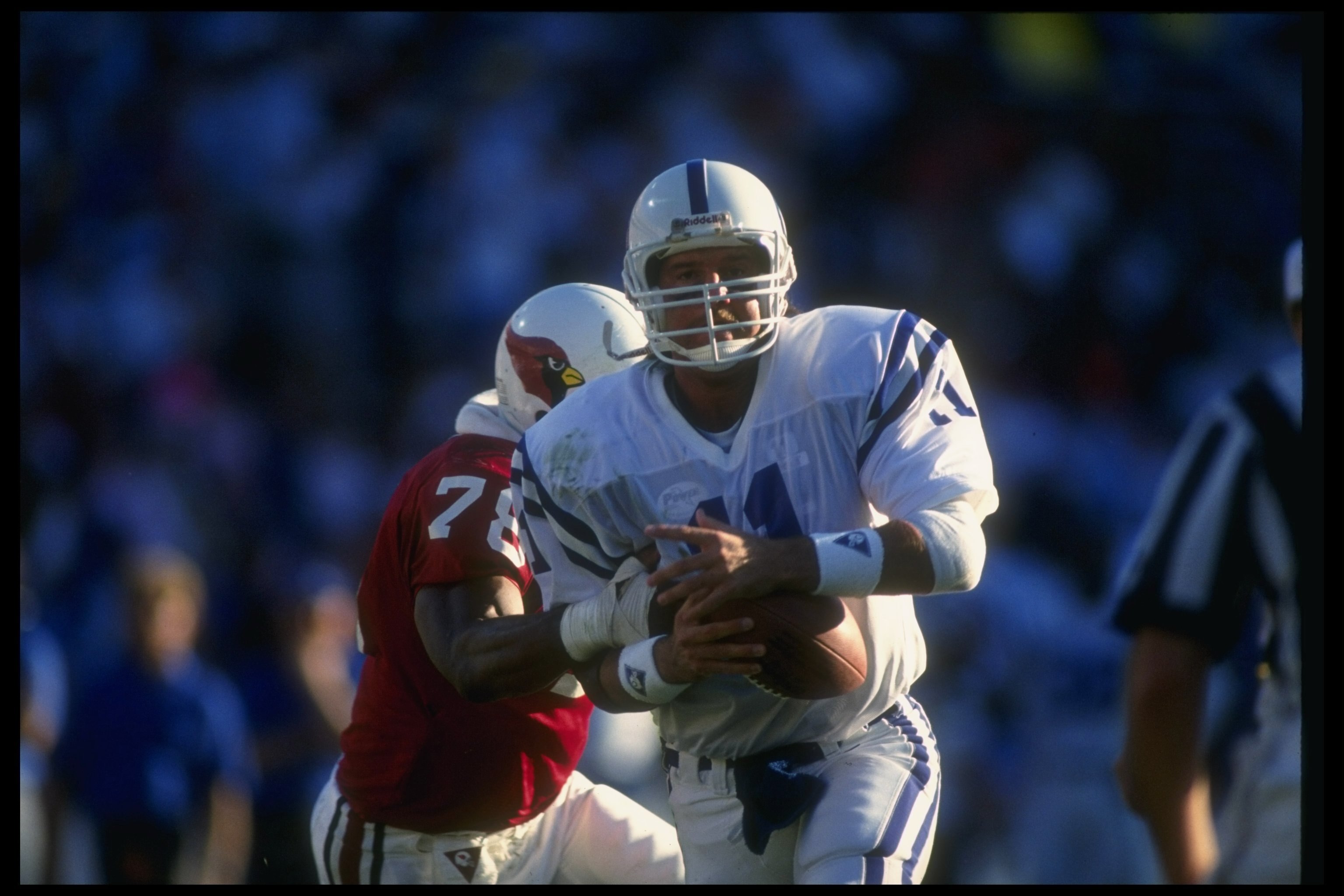 2 Dec 1990:  Quarterback Jeff George of the Indianapolis Colts attempts to avoid the tackle of Phoenix Cardinals defensive lineman Freddie Joe Nunn during a game at the RCA Dome in Indianapolis, Indiana.  The Cardinals won the game, 20-17. Mandatory Credi