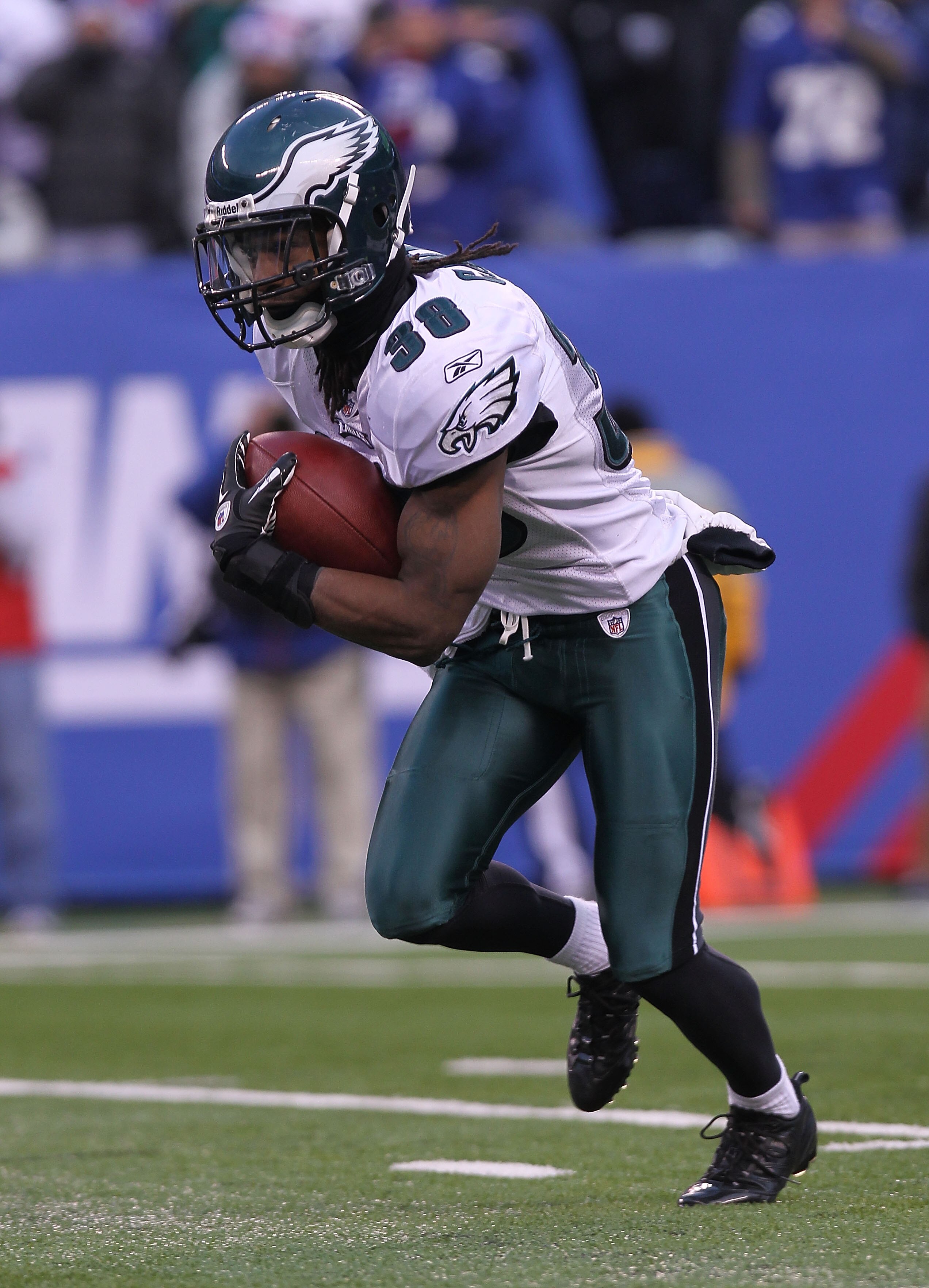 EAST RUTHERFORD, NJ - DECEMBER 19:  Jorrick Calvin #38 of the Philadelphia Eagles rushes against the New York Giants at New Meadowlands Stadium on December 19, 2010 in East Rutherford, New Jersey.  (Photo by Nick Laham/Getty Images)