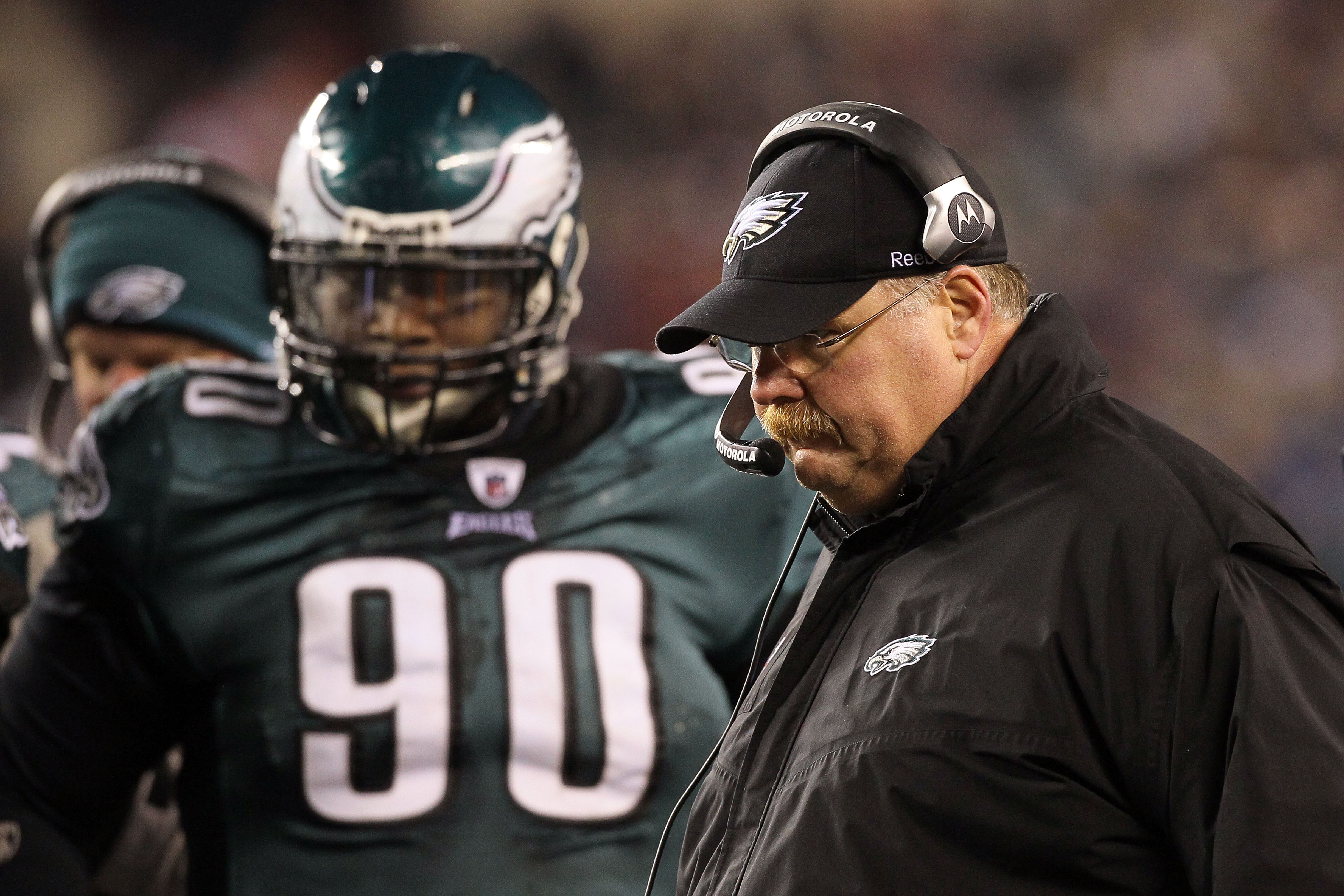 PHILADELPHIA, PA - DECEMBER 26:  Head Coach Andy Reid (R) of the Philadelphia Eagles stands on the sidelines with Antonio Dixon #90 during their game against the Minnesota Vikings at Lincoln Financial Field on December 26, 2010 in Philadelphia, Pennsylvan