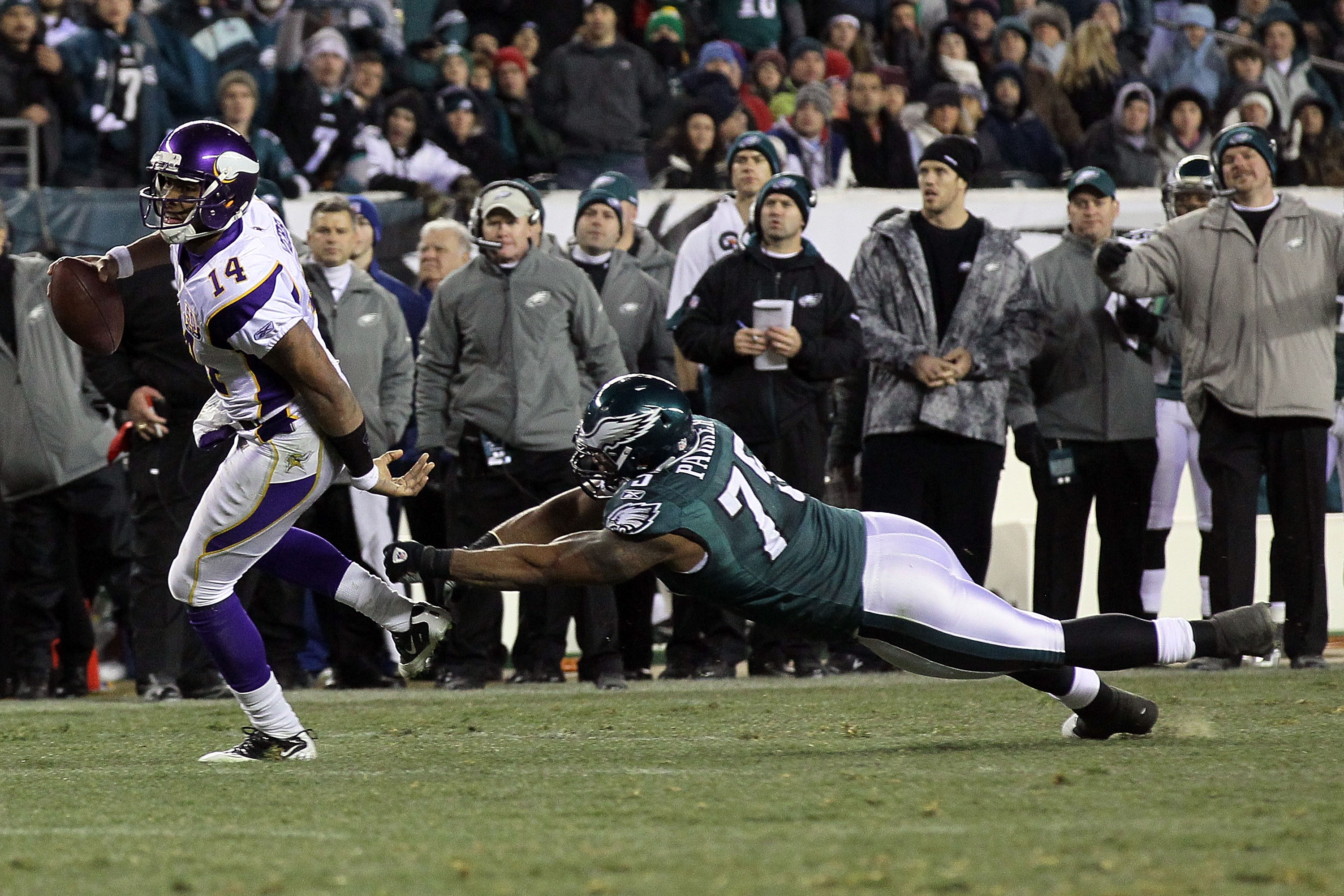 PHILADELPHIA, PA - DECEMBER 28: Joe Webb #14 of the Minnesota Vikings breaks a tackle Juqua Parker #75 of the Philadelphia Eagles to score a touchdown in the 3rd quarter at Lincoln Financial Field on December 28, 2010 in Philadelphia, Pennsylvania. (Photo