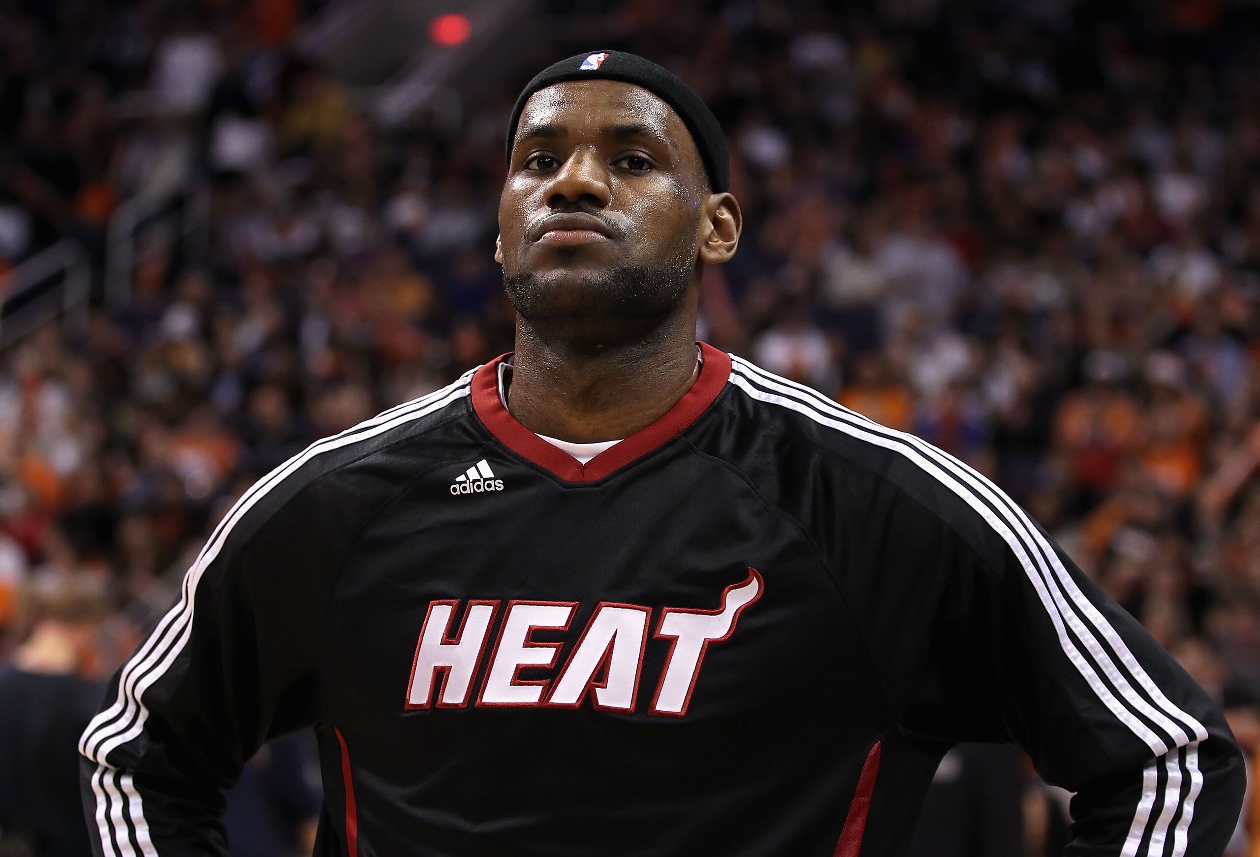 PHOENIX - DECEMBER 23:  LeBron James #6 of the Miami Heat stands attended for the National Anthem before the NBA game against the Phoenix Suns at US Airways Center on December 23, 2010 in Phoenix, Arizona. NOTE TO USER: User expressly acknowledges and agr