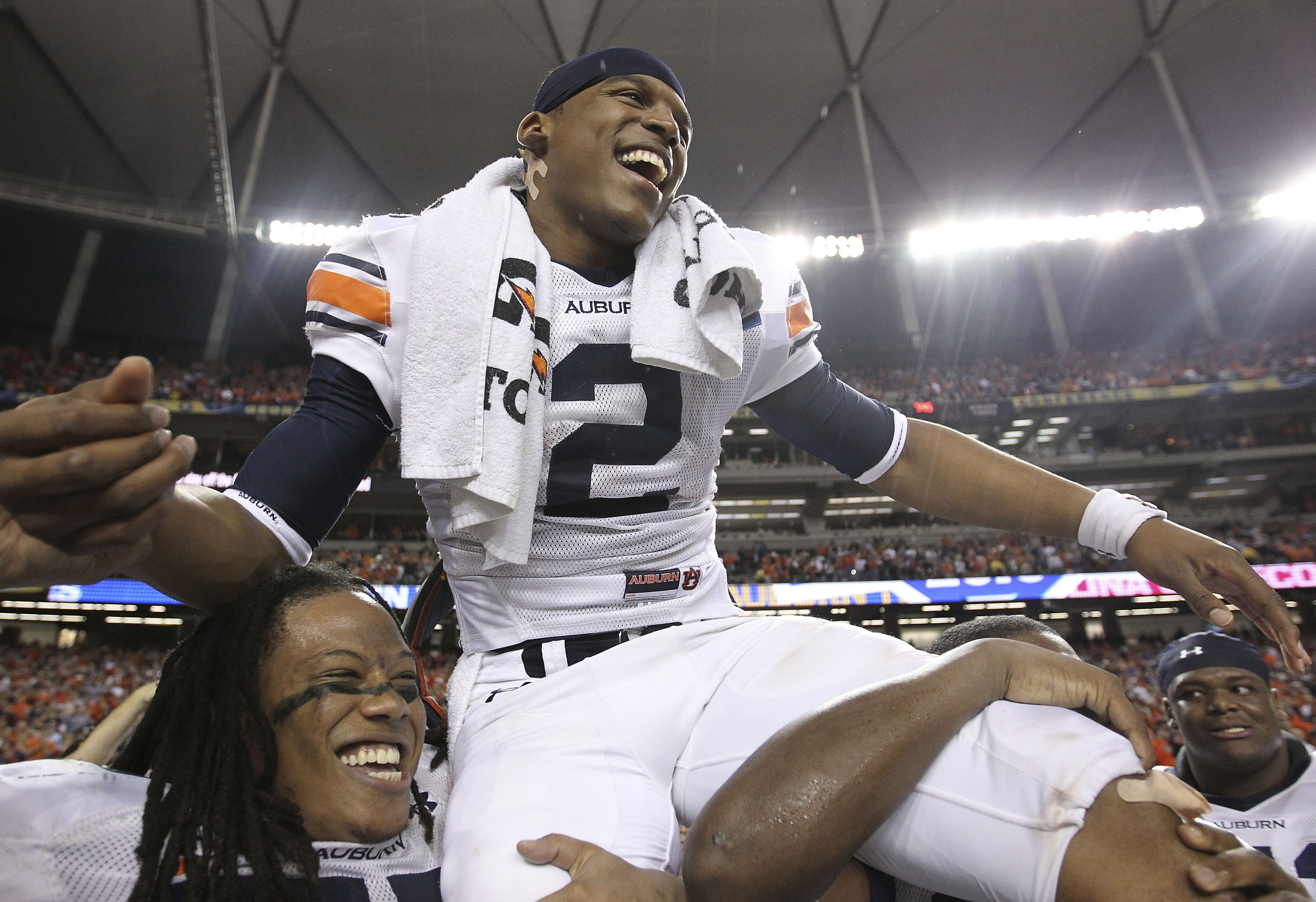ATLANTA - DECEMBER 4:  Quarterback Cam Newton #2 of the Auburn Tigers is carried on the field after the 2010 SEC Championship against the South Carolina Gamecocks at Georgia Dome on December 4, 2010 in Atlanta, Georgia. (Photo by Mike Zarrilli/Getty Image