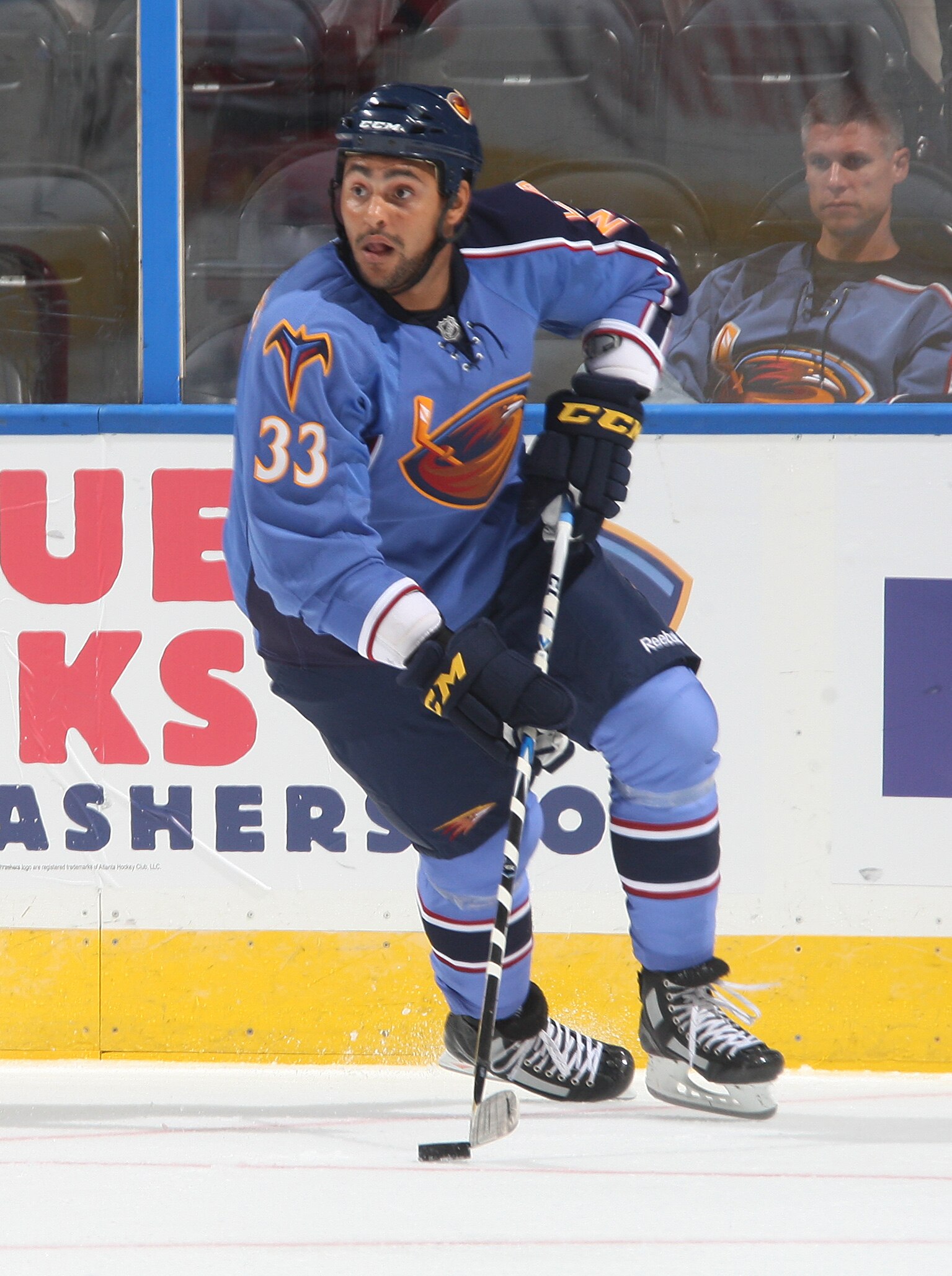 ATLANTA - SEPTEMBER 25: Dustin Byfuglien #33 of the Atlanta Thrashers carries the puck against the Carolina Hurricanes at Philips Arena on September 25, 2010 in Atlanta, Georgia. (Photo by Scott Cunningham/Getty Images)
