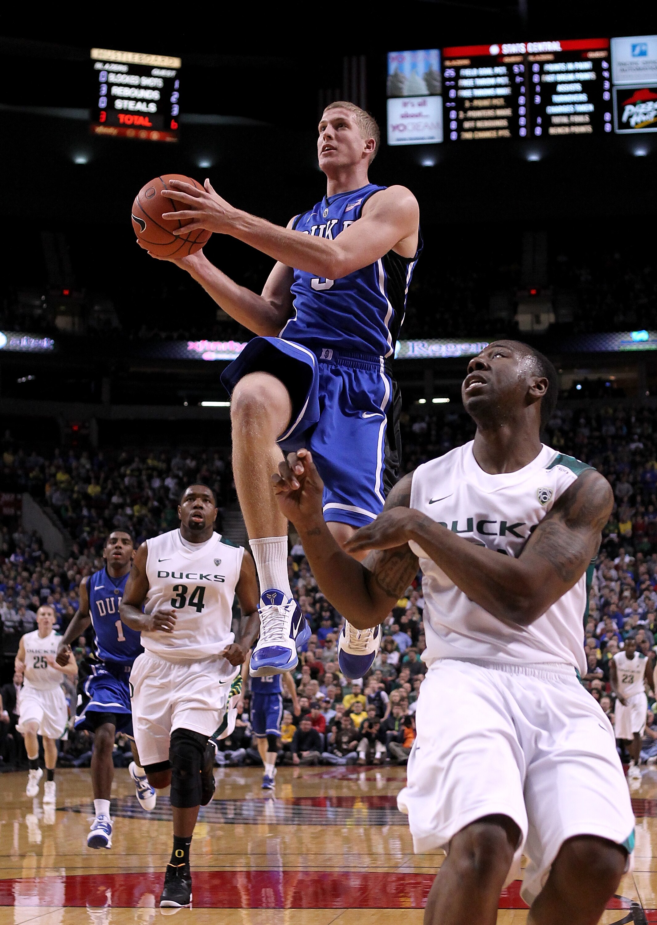 PORTLAND, OR - NOVEMBER 27:  Mason Plumlee #5 of the Duke Blue Devils goes up for a shot against the Oregon Ducks on November 27, 2010 at the Rose Garden in Portland, Oregon.  (Photo by Jonathan Ferrey/Getty Images)