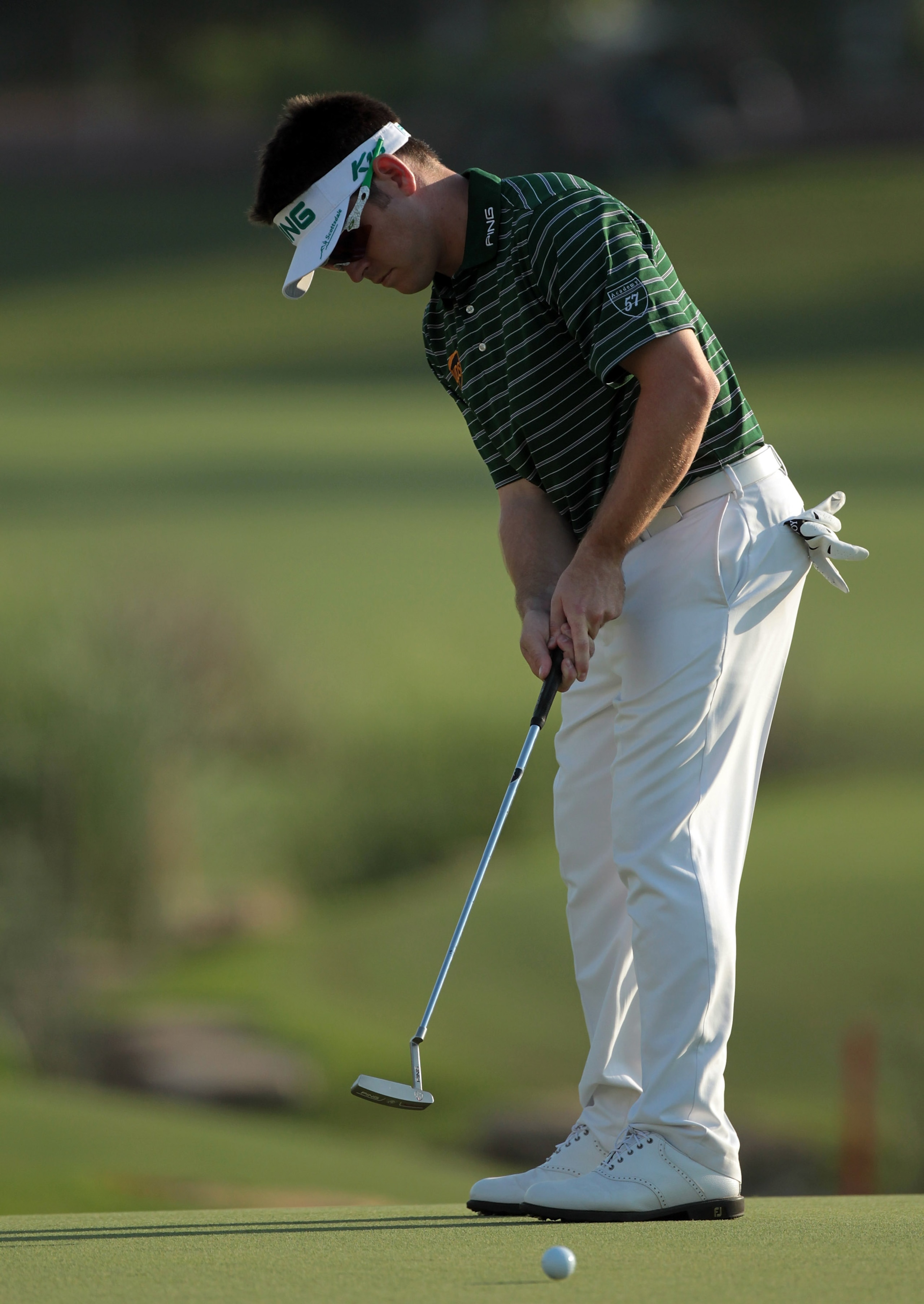 DUBAI, UNITED ARAB EMIRATES - NOVEMBER 25:  Louis Oosthuizen of South Africa putts at the 18th hole during the first round of the Dubai World Championship on the Earth Course at Jumeirah Golf Estates on November 25, 2010 in Dubai, United Arab Emirates.  (