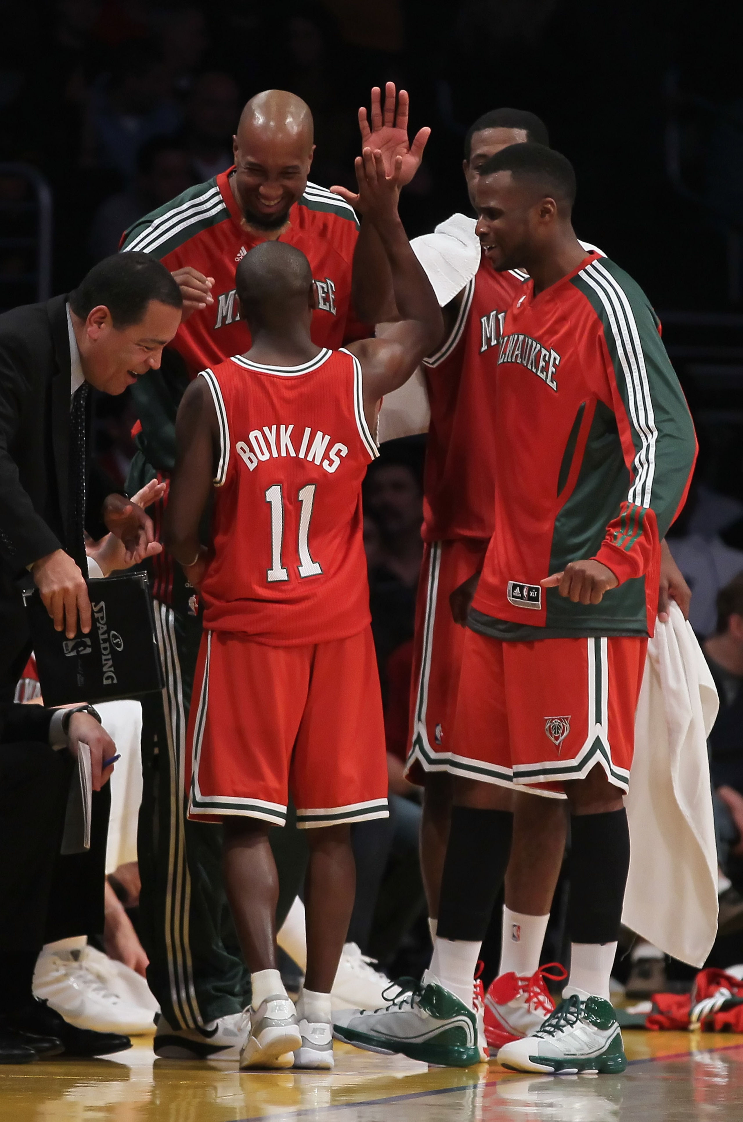 LOS ANGELES, CA - DECEMBER 21:  Earl Boykins #11 of the Milwaukee Bucks receives high fives from his teammates on the bench during the second half against the Los Angeles Lakers at Staples Center on December 21, 2010 in Los Angeles, California. The Bucks