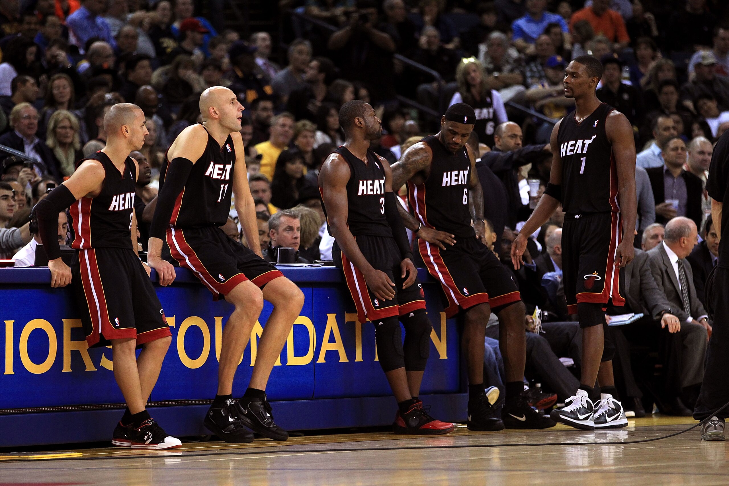OAKLAND, CA - DECEMBER 10: Carlos Arroyo #8, Zydrunas Ilgauskas #11, Dwyane Wade #3, LeBron James #6 and Chris Bosh #1 of the Miami Heat wait on the side of the court during a time out of their game against the Golden State Warriors at Oracle Arena on Dec