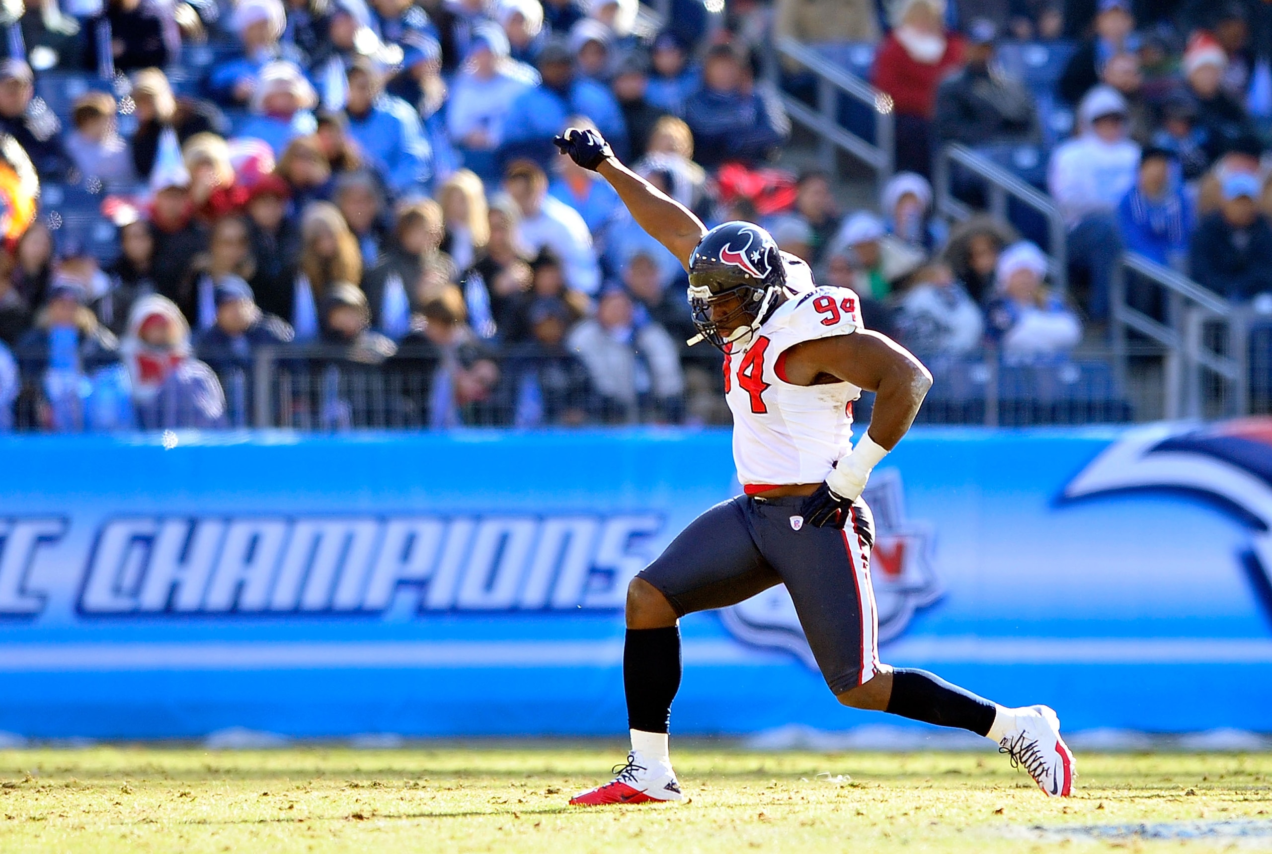 NASHVILLE, TN - DECEMBER 19:  Antonio Smith #94 of the Houston Texans celebrates after making a sack against the Tennessee Titans during the first half at LP Field on December 19, 2010 in Nashville, Tennessee.  (Photo by Grant Halverson/Getty Images)