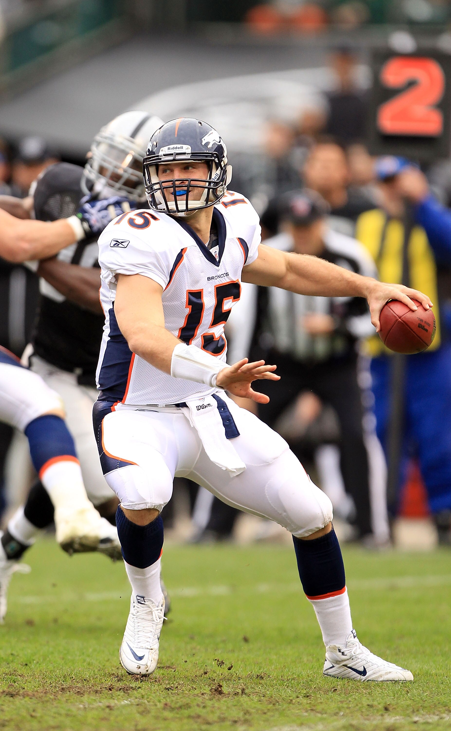 OAKLAND, CA - DECEMBER 19:  Tim Tebow #15 of the Denver Broncos in action during their game against the Oakland Raiders at Oakland-Alameda County Coliseum on December 19, 2010 in Oakland, California.  (Photo by Ezra Shaw/Getty Images)