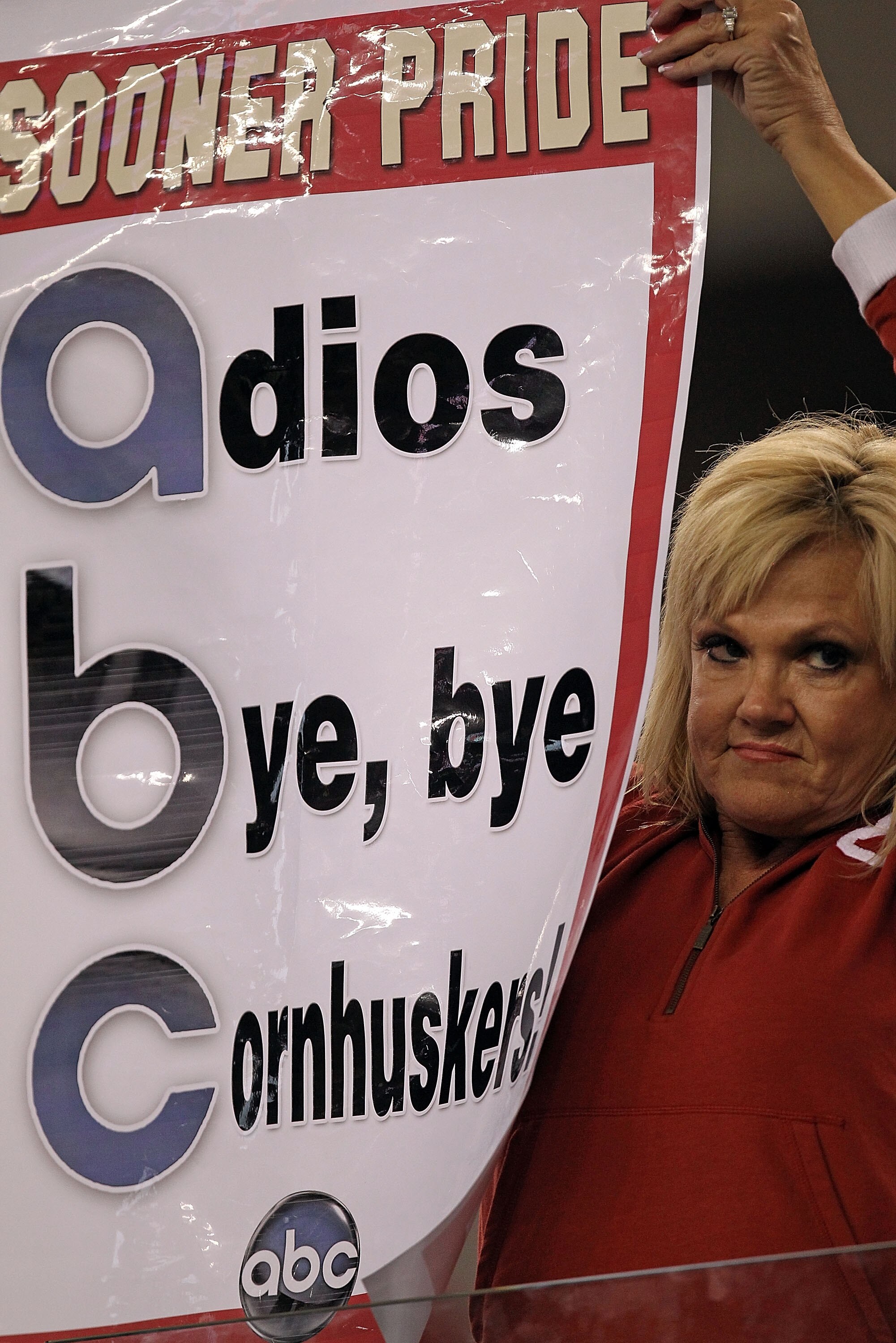 ARLINGTON, TX - DECEMBER 04:  An Oklahoma Sooners fan holds up a sign as the Nebraska Cornhuskers play their last game in the Big 12 during the Big 12 Championship at Cowboys Stadium on December 4, 2010 in Arlington, Texas.  (Photo by Ronald Martinez/Gett