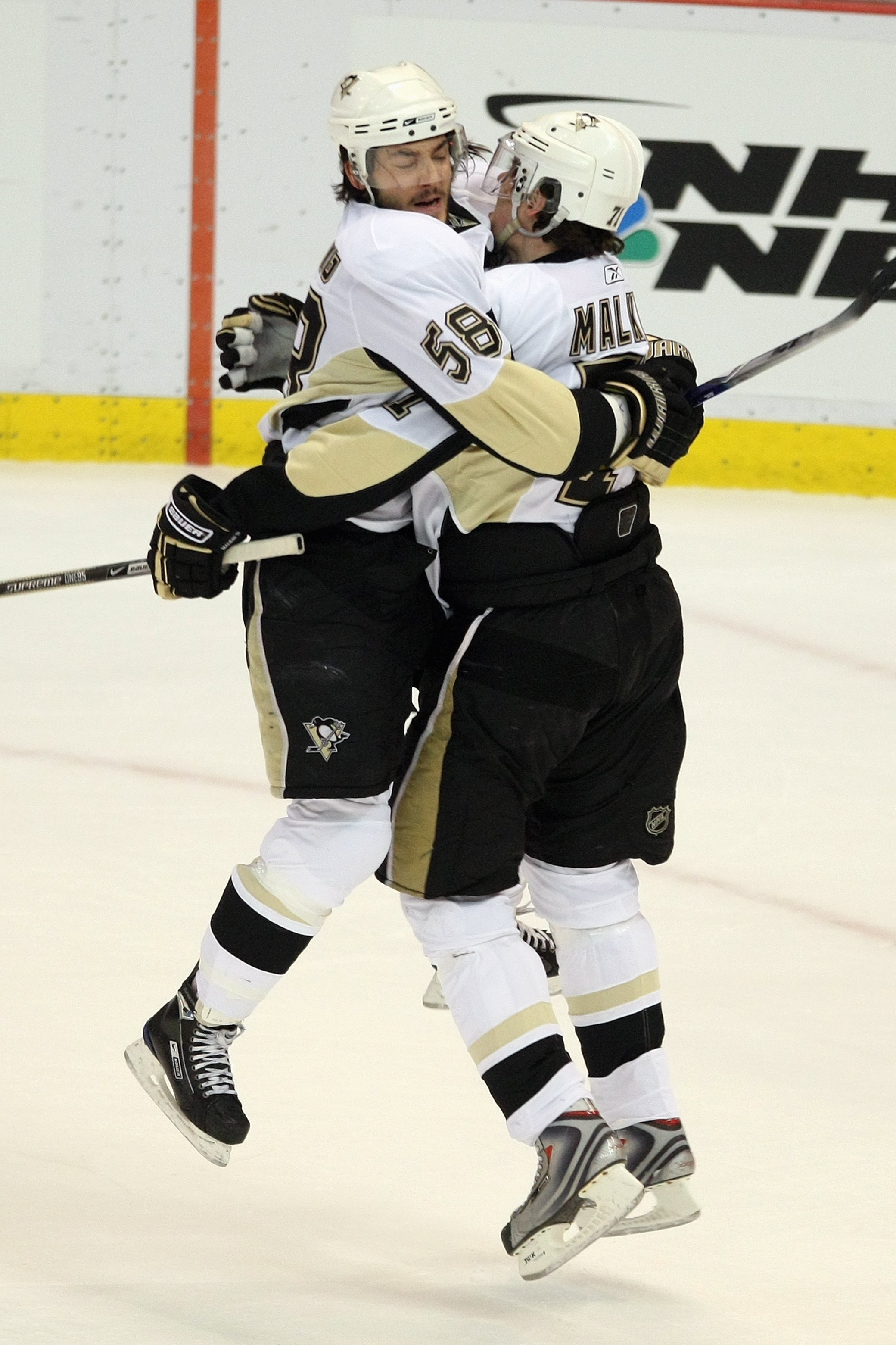 DETROIT - MAY 31:  Kris Letang #58 and Evgeni Malkin #71 of the Pittsburgh Penguins celebrate against the Detroit Red Wings during Game Two of the 2009 Stanley Cup Finals at Joe Louis Arena on May 31, 2009 in Detroit, Michigan. (Photo by Bruce Bennett/Get