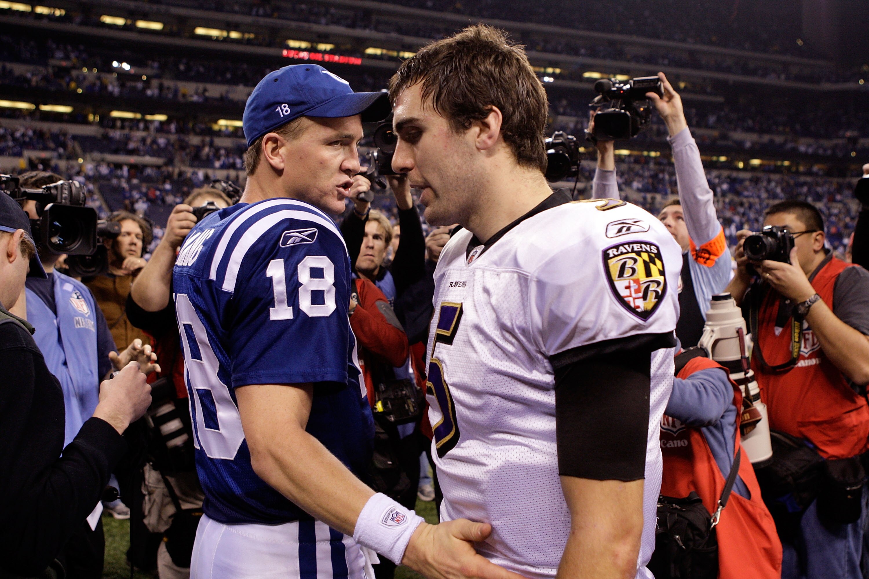 INDIANAPOLIS - JANUARY 16:  Peyton Manning #18 of the Indianapolis Colts greets Joe Flacco #5 of the Baltimore Ravens as they walk off the field after the Colts 20-3 victory in the AFC Divisional Playoff Game at Lucas Oli Stadium on January 16, 2010 in In