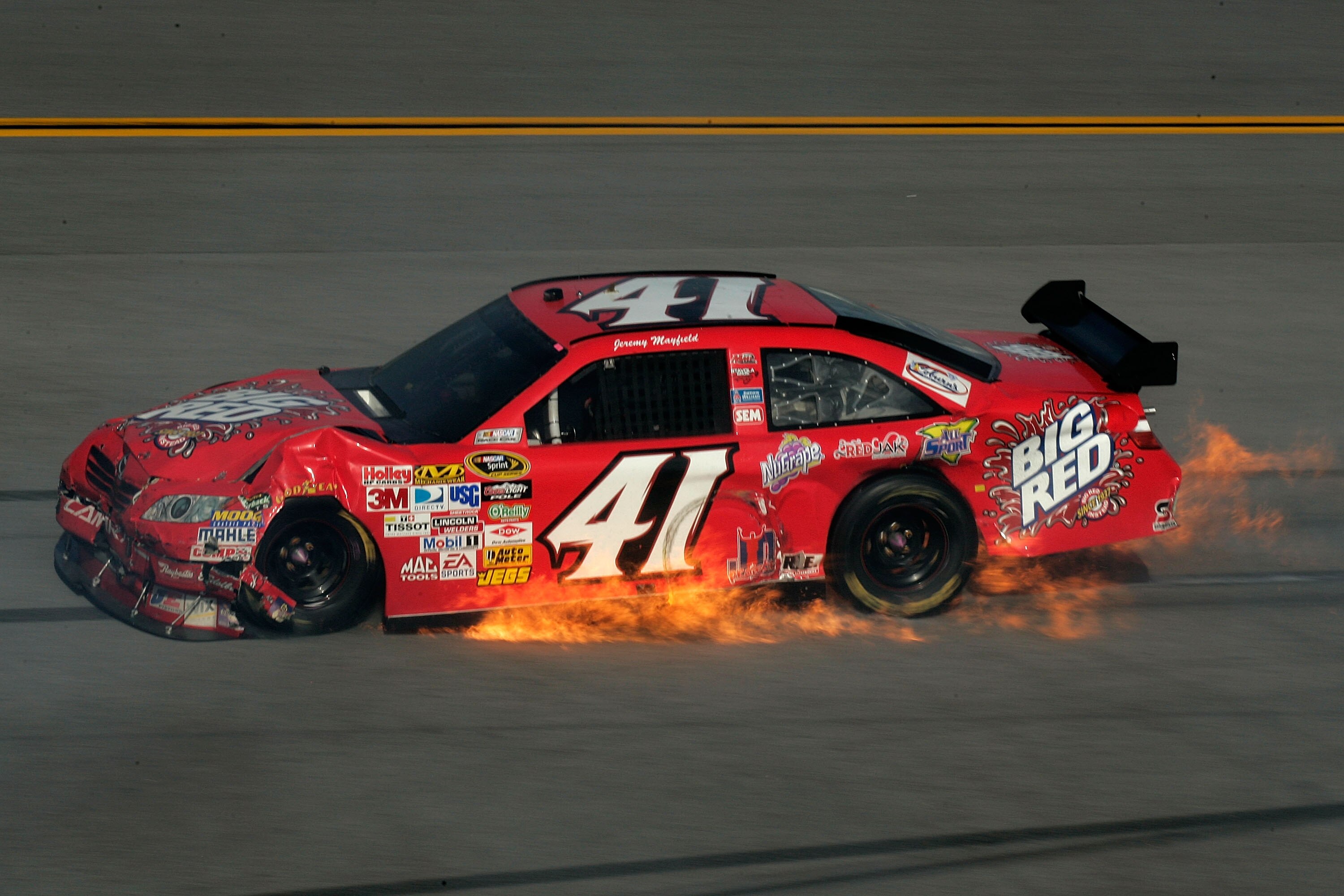 TALLADEGA, AL - APRIL 26:  Jeremy Mayfield, driver of the #41 Big Red Toyota, suffers damage during the NASCAR Sprint Cup Series Aaron's 499 at Talladega Superspeedway on April 26, 2009 in Talladega, Alabama.  (Photo by Jason Smith/Getty Images for NASCAR