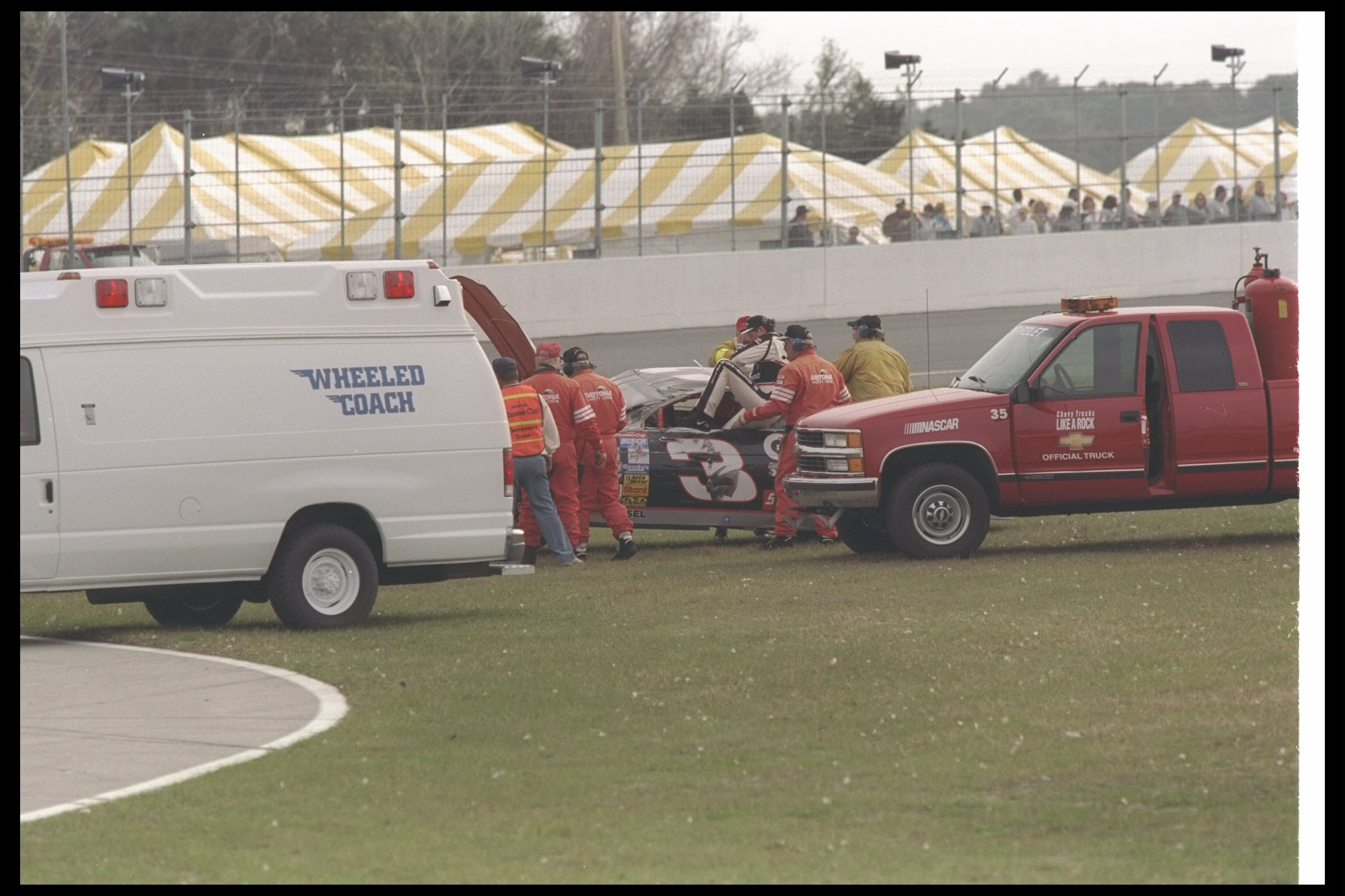 16 Feb 1997: Dale Earnhardt gets back into his damaged car during the NASCAR Daytona 500 at Daytona International Speedway in Daytona Beach, Florida.