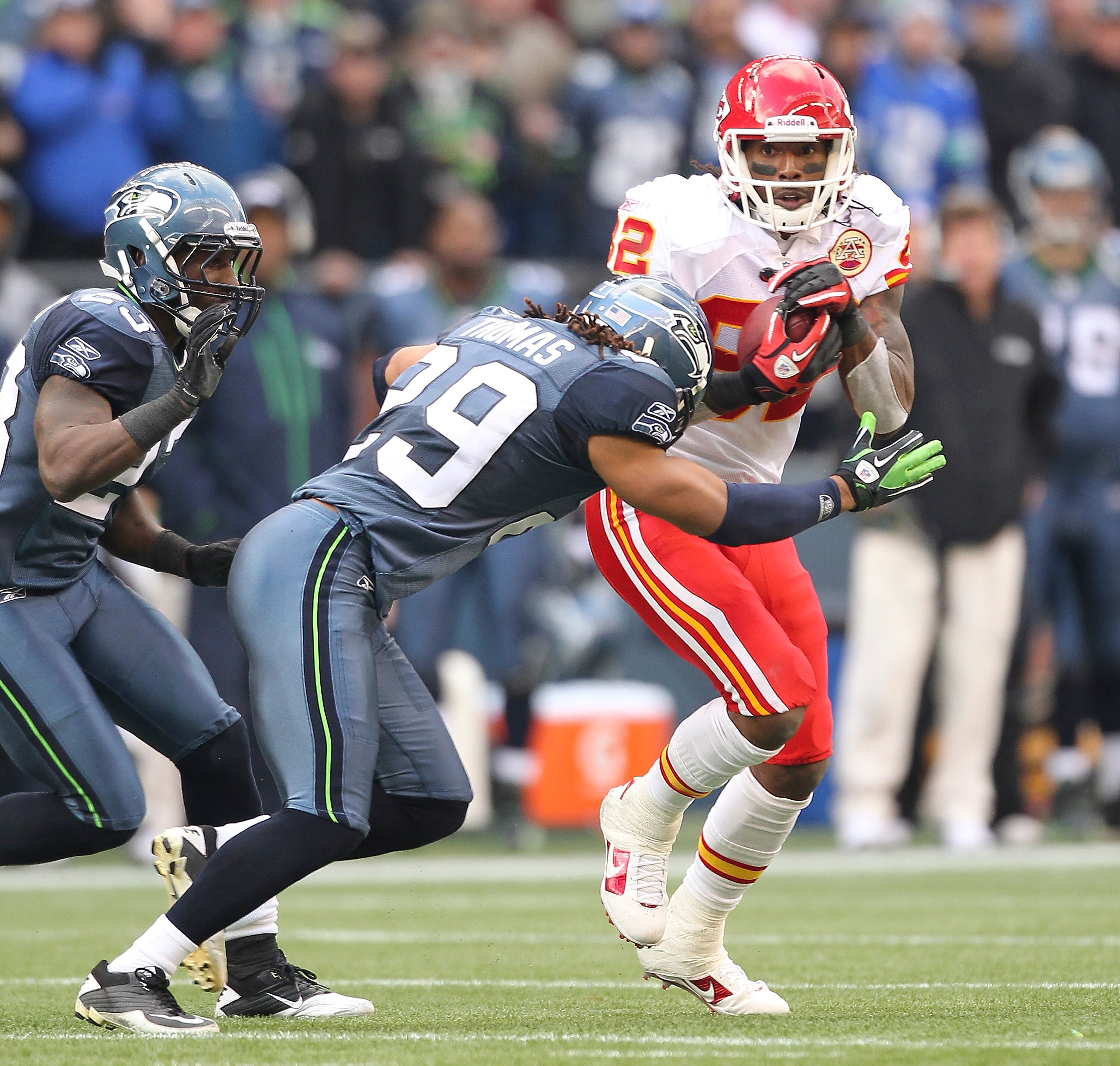 SEATTLE - NOVEMBER 28:  Wide receiver Dwayne Bowe #82 of the Kansas City Chiefs rushes against Earl Thomas #29 and Marcus Trufant #23 of the Seattle Seahawks at Qwest Field on November 28, 2010 in Seattle, Washington. The Chiefs defeated the Seahawks 42-2