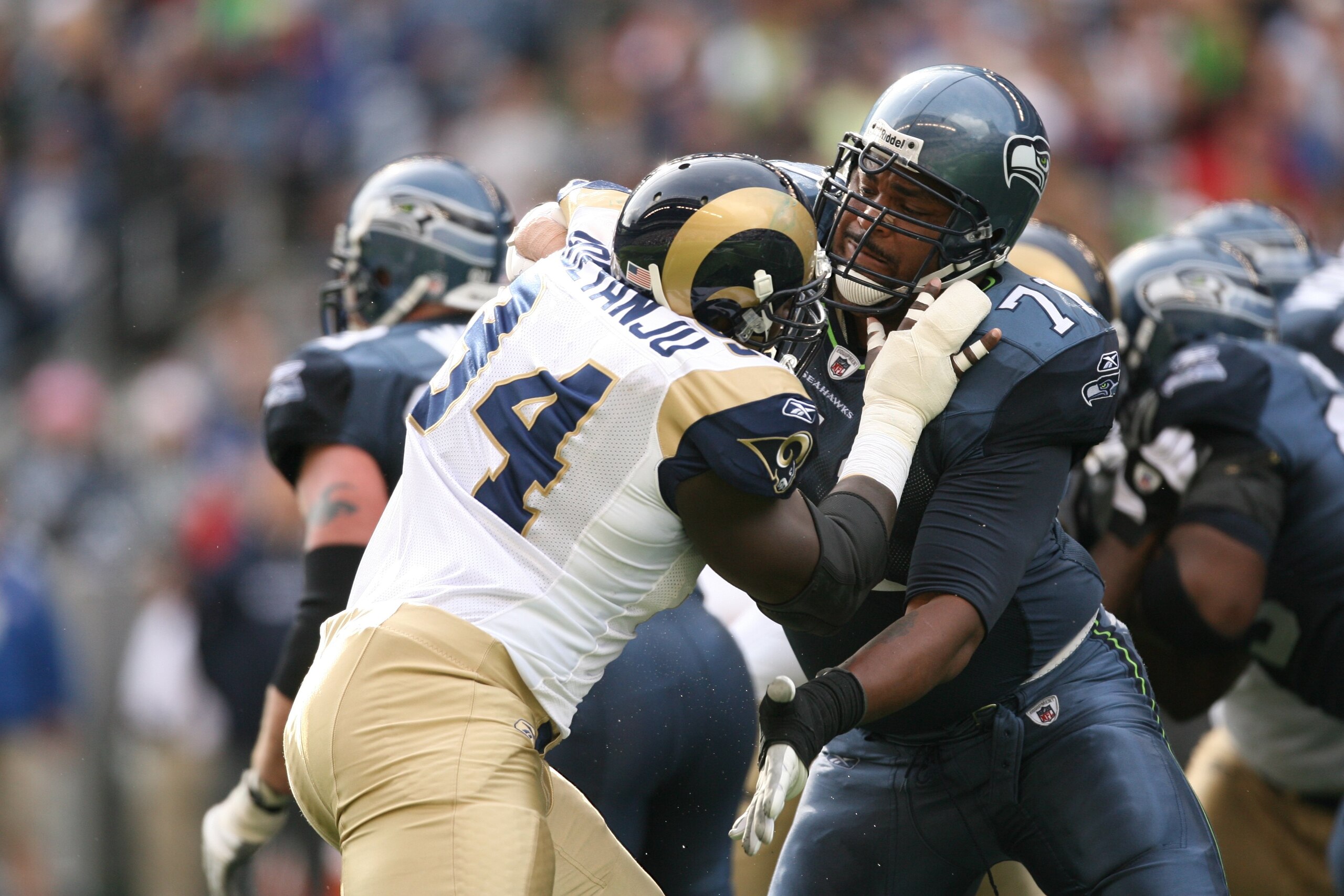 SEATTLE - SEPTEMBER 21:  Walter Jones #71 of the Seattle Seahawks blocks Victor Adeyanju #94 of the St. Louis Rams during the game on September 21, 2008 at Qwest Field in Seattle, Washington. (Photo by Otto Greule Jr/Getty Images)