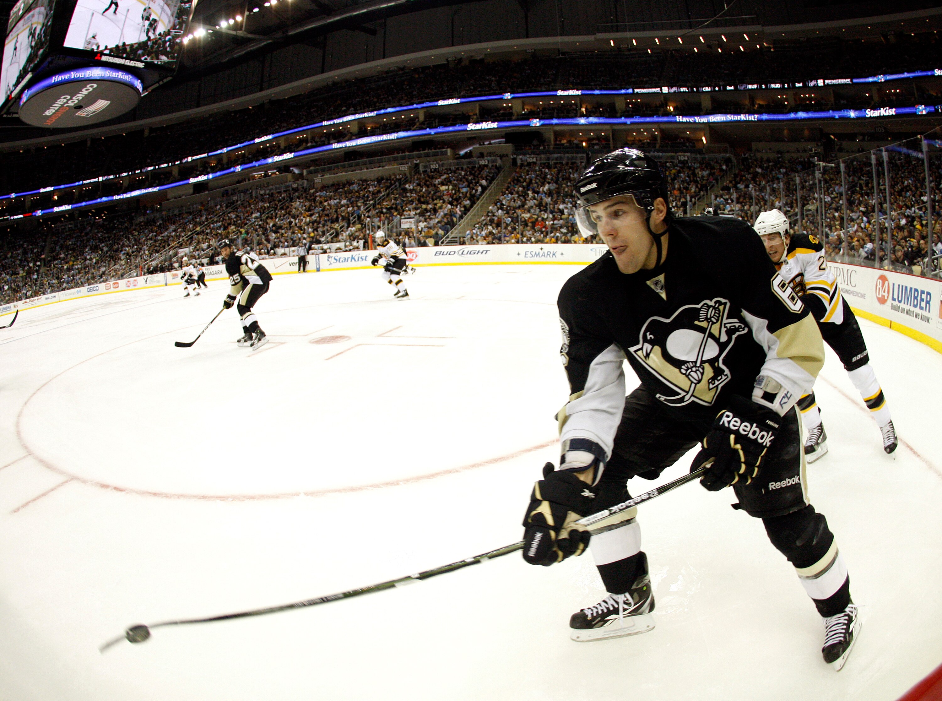 PITTSBURGH - NOVEMBER 10:  Ben Lovejoy #6 of the Pittsburgh Penguins clears the puck up the wall against the Boston Bruins at Consol Energy Center on November 10, 2010 in Pittsburgh, Pennsylvania.  The Bruins defeated the Penguins 7-4.(Photo by Justin K.