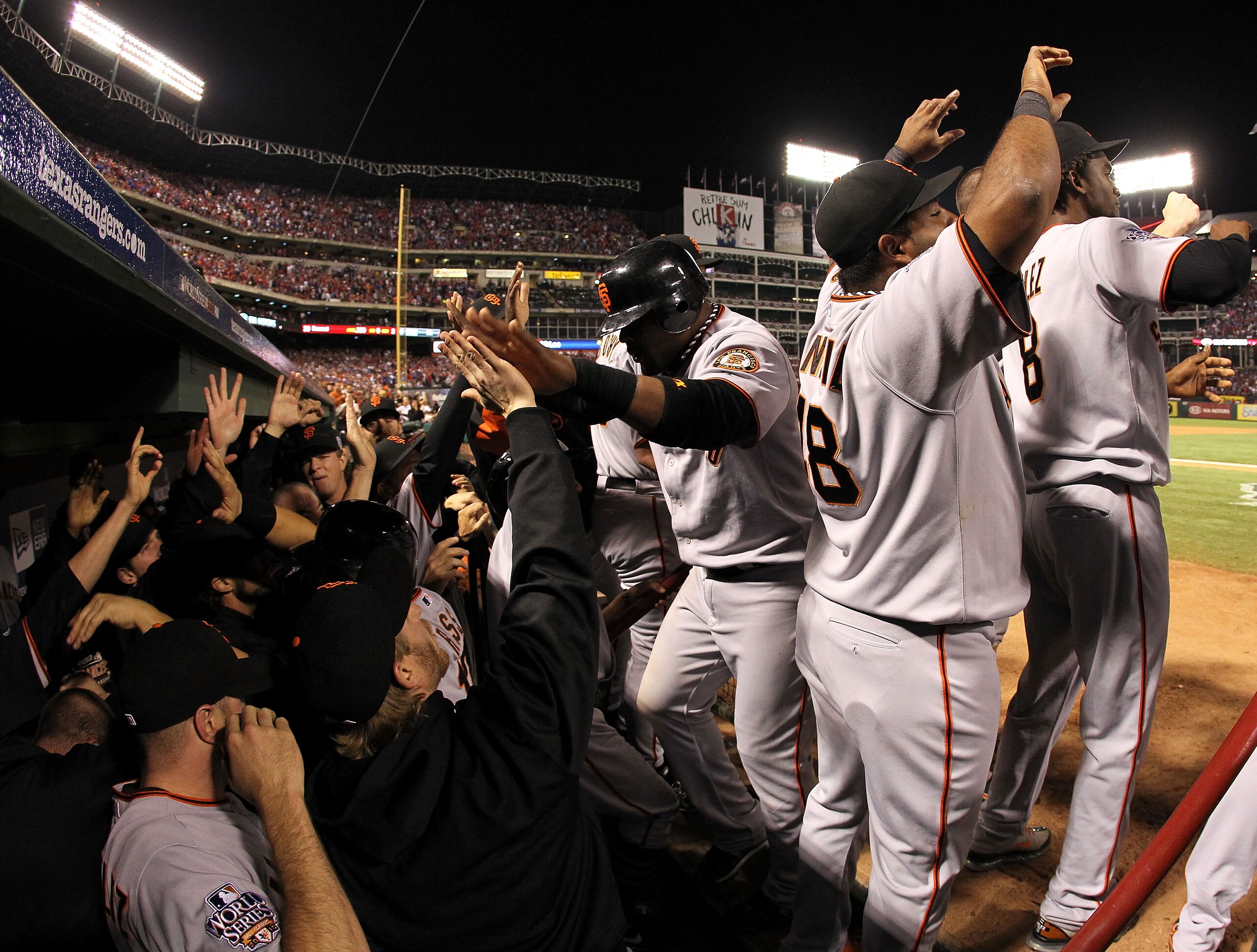 ARLINGTON, TX - NOVEMBER 01:  Juan Uribe #5 of the San Francisco Giants celebrates with his teammates in the dugout after he scored on a 3-run home run hit by Edgar Renteria in the seventh inning against the Texas Rangers in Game Five of the 2010 MLB Worl