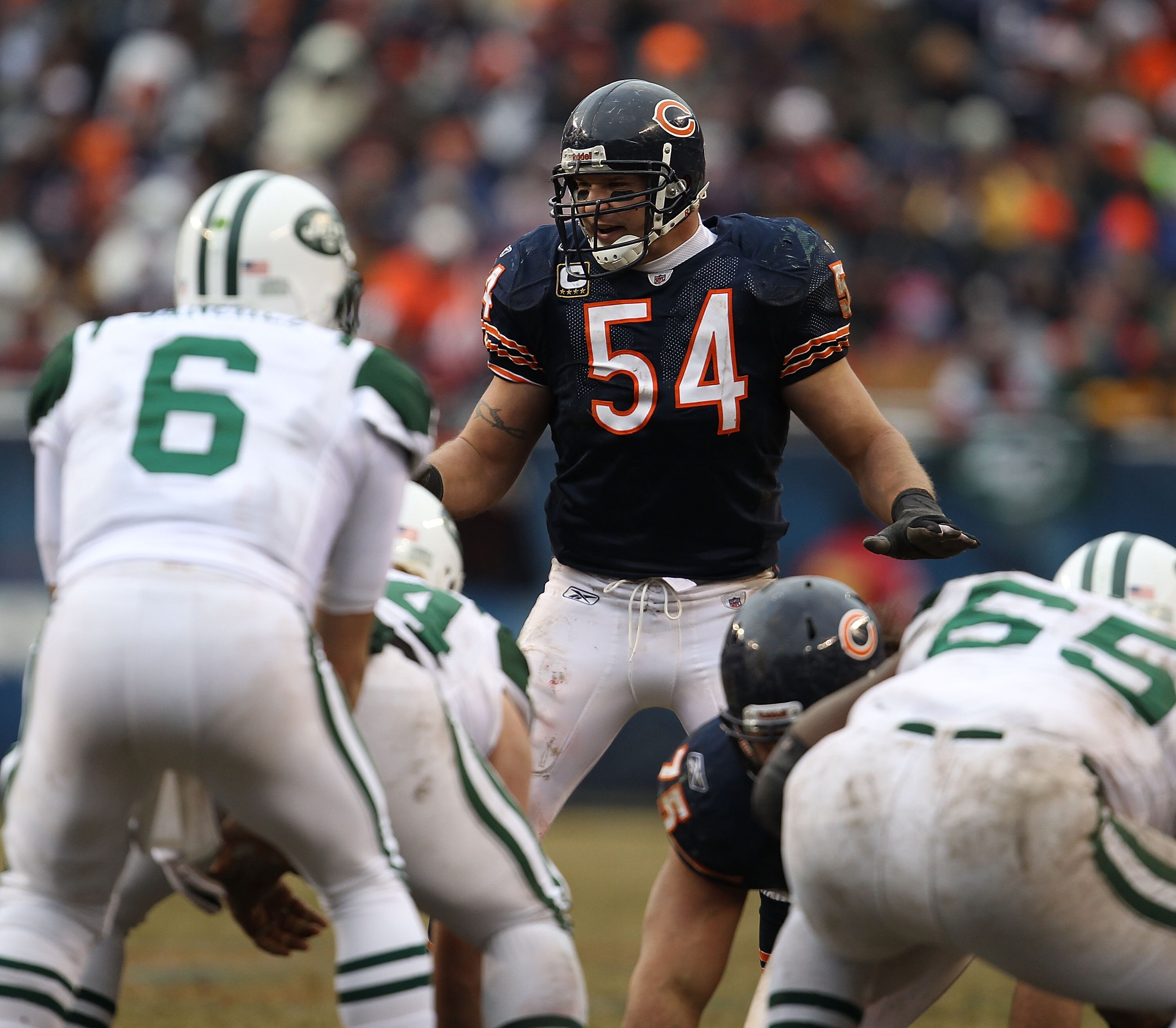 CHICAGO, IL - DECEMBER 26: Brian Urlacher #54 of the Chicago Bears awaits the start of play as Mark Sanchez #6 of the New York Jets calls offensive signals at Soldier Field on December 26, 2010 in Chicago, Illinois. The Bears defeated the Jets 38-34. (Pho