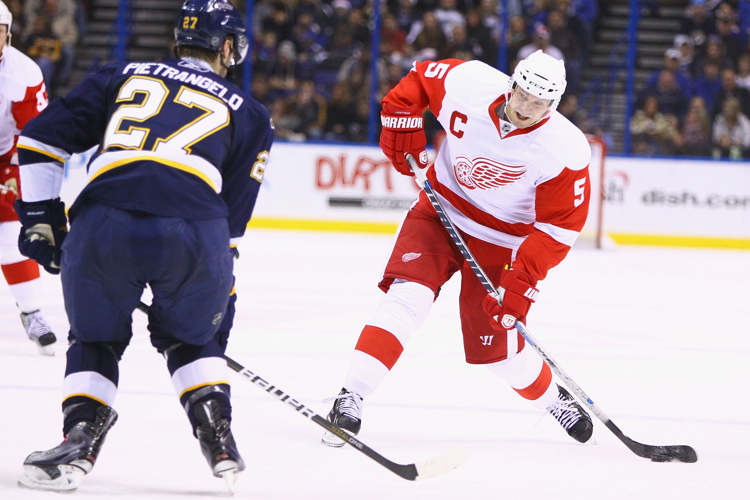 ST. LOUIS, MO - DECEMBER 23: Nicklas Lidstrom #5 of the Detroit Red Wings shoots the puck against the St. Louis Blues at the Scottrade Center on December 23, 2010 in St. Louis, Missouri.  (Photo by Dilip Vishwanat/Getty Images)