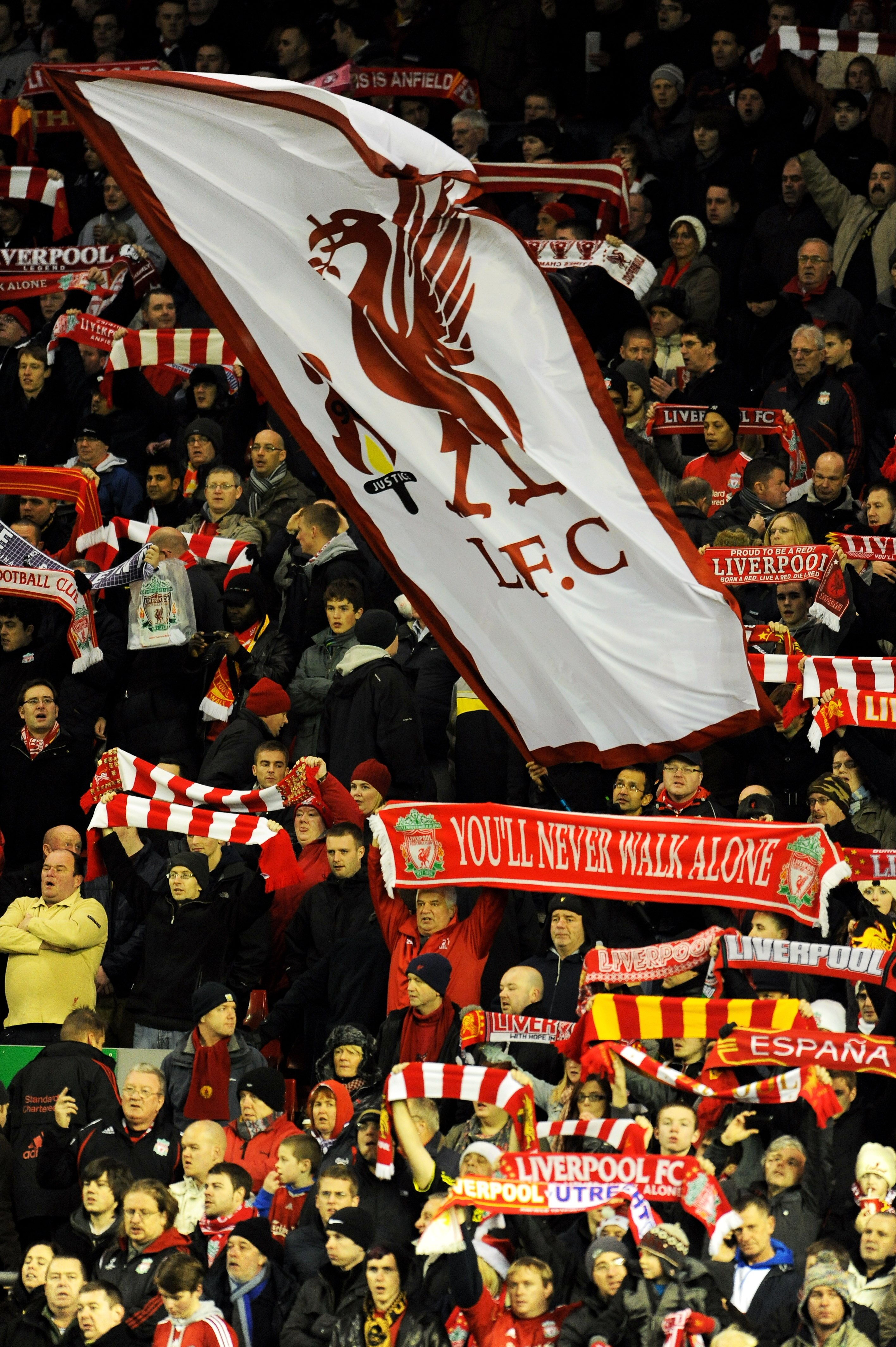 LIVERPOOL, ENGLAND - DECEMBER 15:  Liverpool fans cheer on their team during the UEFA Europa League Group K match between Liverpool and FC Utrecht at Anfield on December 15, 2010 in Liverpool, England.  (Photo by Clint Hughes/Getty Images)