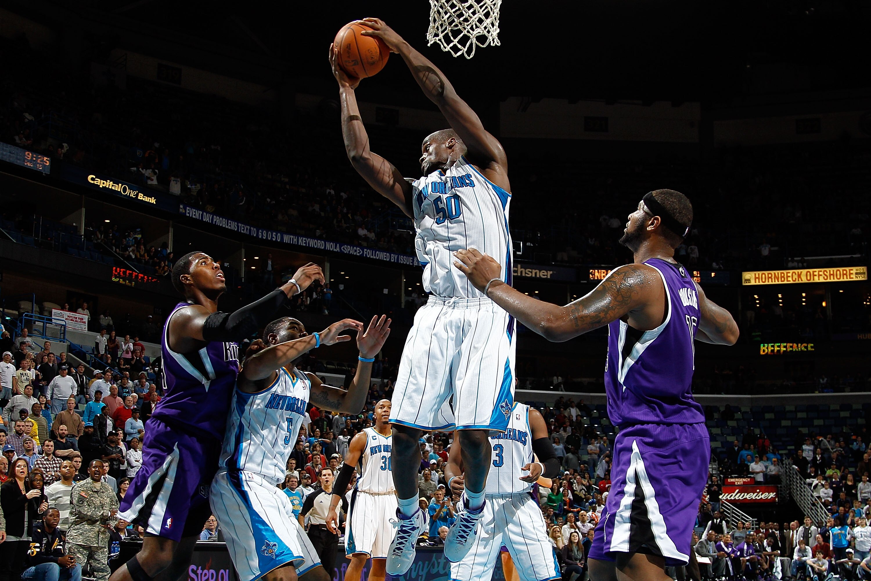 NEW ORLEANS, LA - DECEMBER 15:  Emeka Okafor #50 of the New Orleans Hornets grabs a rebound over DeMarcus Cousins #15 of the Sacramento Kings at the New Orleans Arena on December 15, 2010 in New Orleans, Louisiana.  NOTE TO USER: User expressly acknowledg
