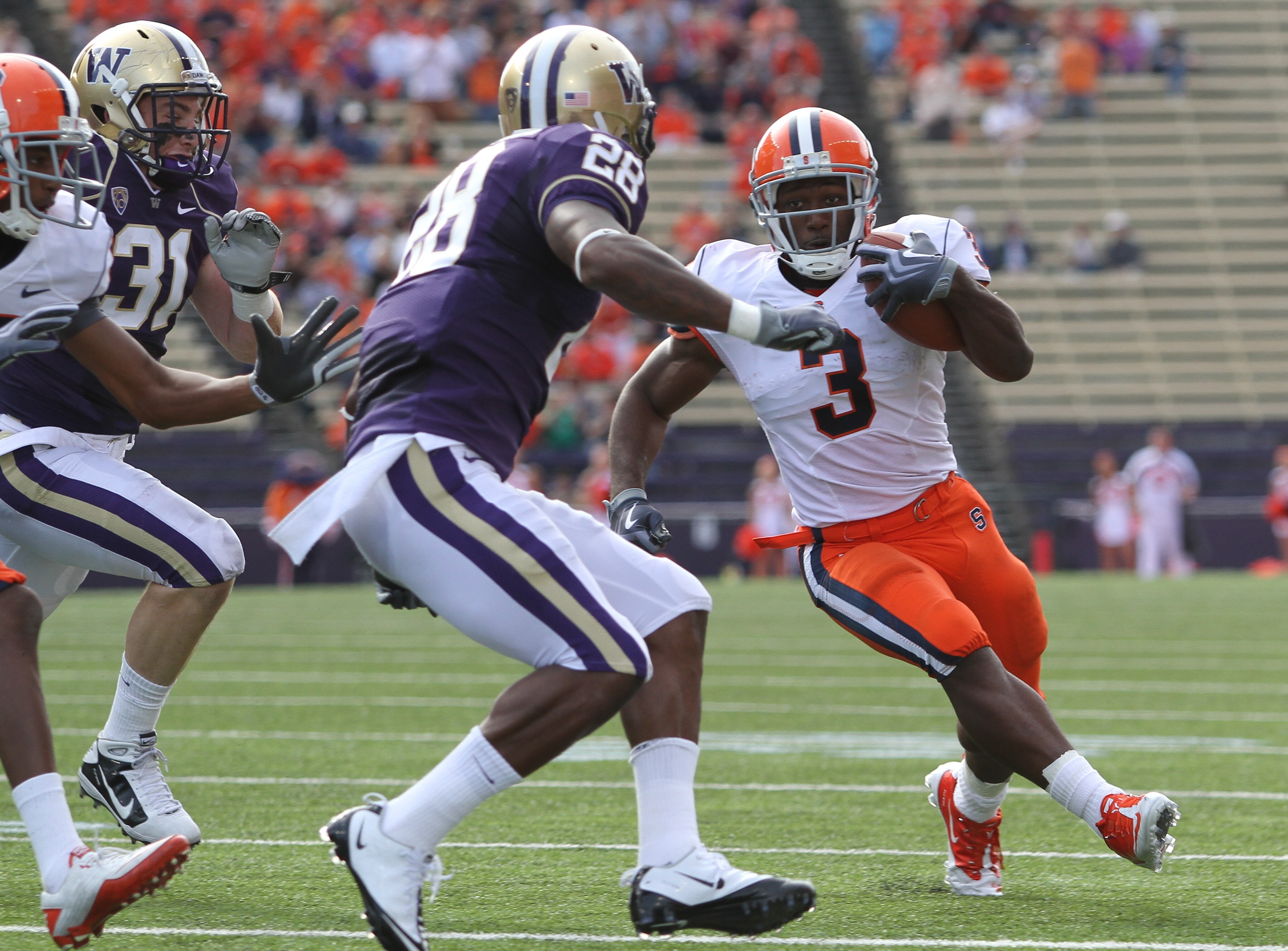 SEATTLE - SEPTEMBER 11:  Running back Delone Carter #3 of the Syracuse Orange rushes against Quinton Richardson #28 of the Washington Huskies on September 11, 2010 at Husky Stadium in Seattle, Washington. (Photo by Otto Greule Jr/Getty Images)
