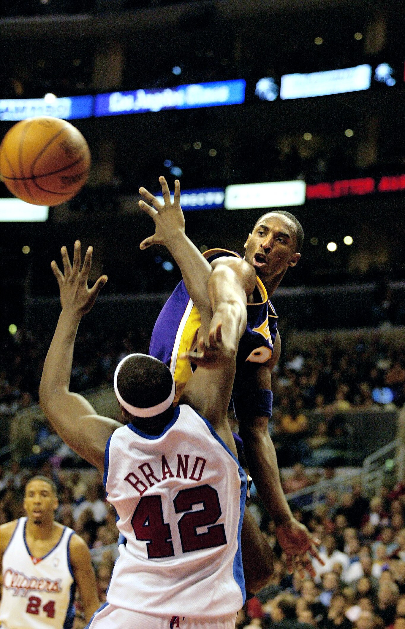 LOS ANGELES - NOVEMBER 1:  Kobe Bryant #8 of the Los Angeles Lakers gets the ball past Elton Brand #42 of the Los Angeles Clippers on November 1, 2002 at Staples Center in Los Angeles, California.  NOTE TO USER: User expressly acknowledges and agrees that