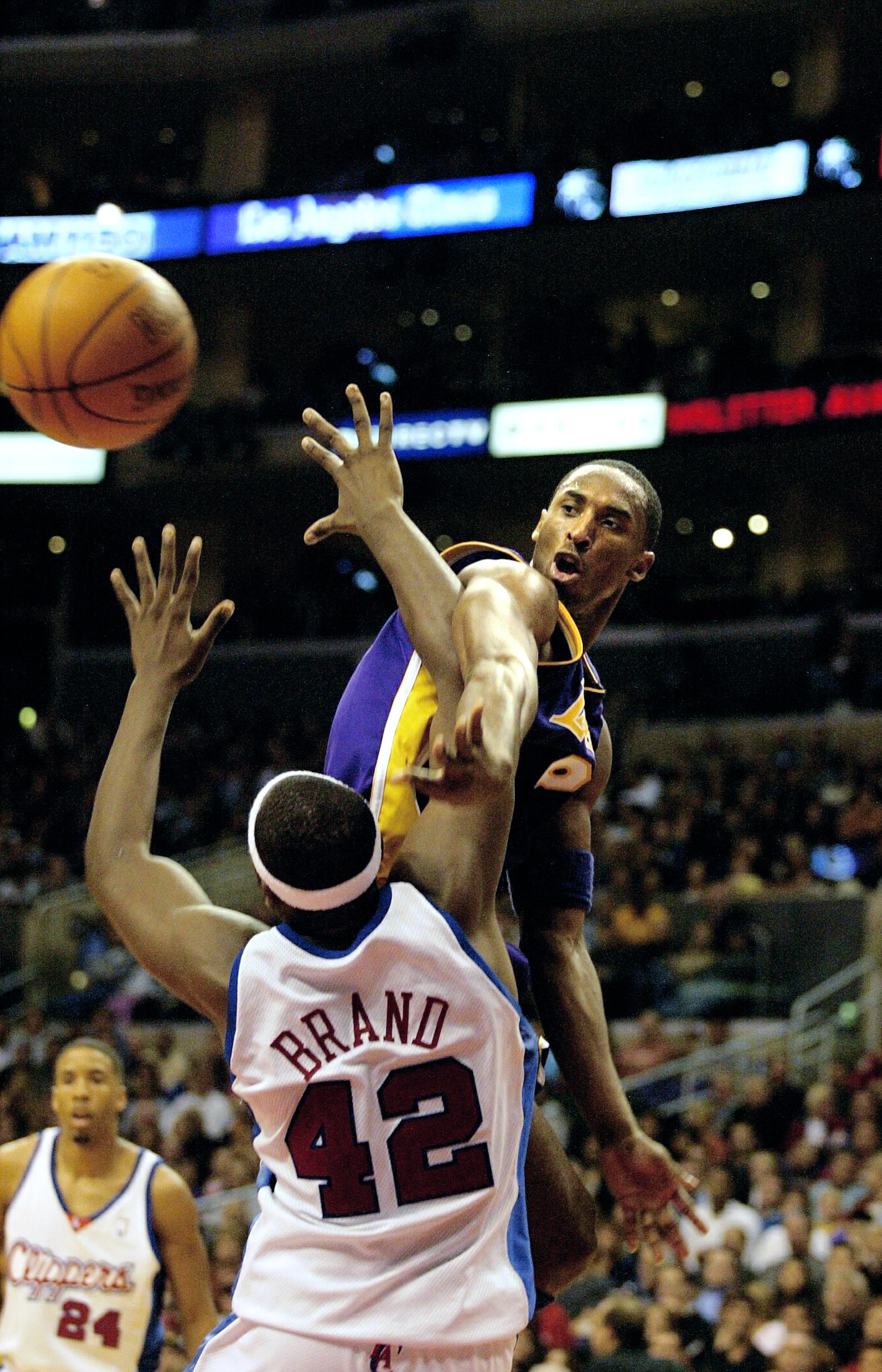 LOS ANGELES - NOVEMBER 1:  Kobe Bryant #8 of the Los Angeles Lakers gets the ball past Elton Brand #42 of the Los Angeles Clippers on November 1, 2002 at Staples Center in Los Angeles, California.  NOTE TO USER: User expressly acknowledges and agrees that