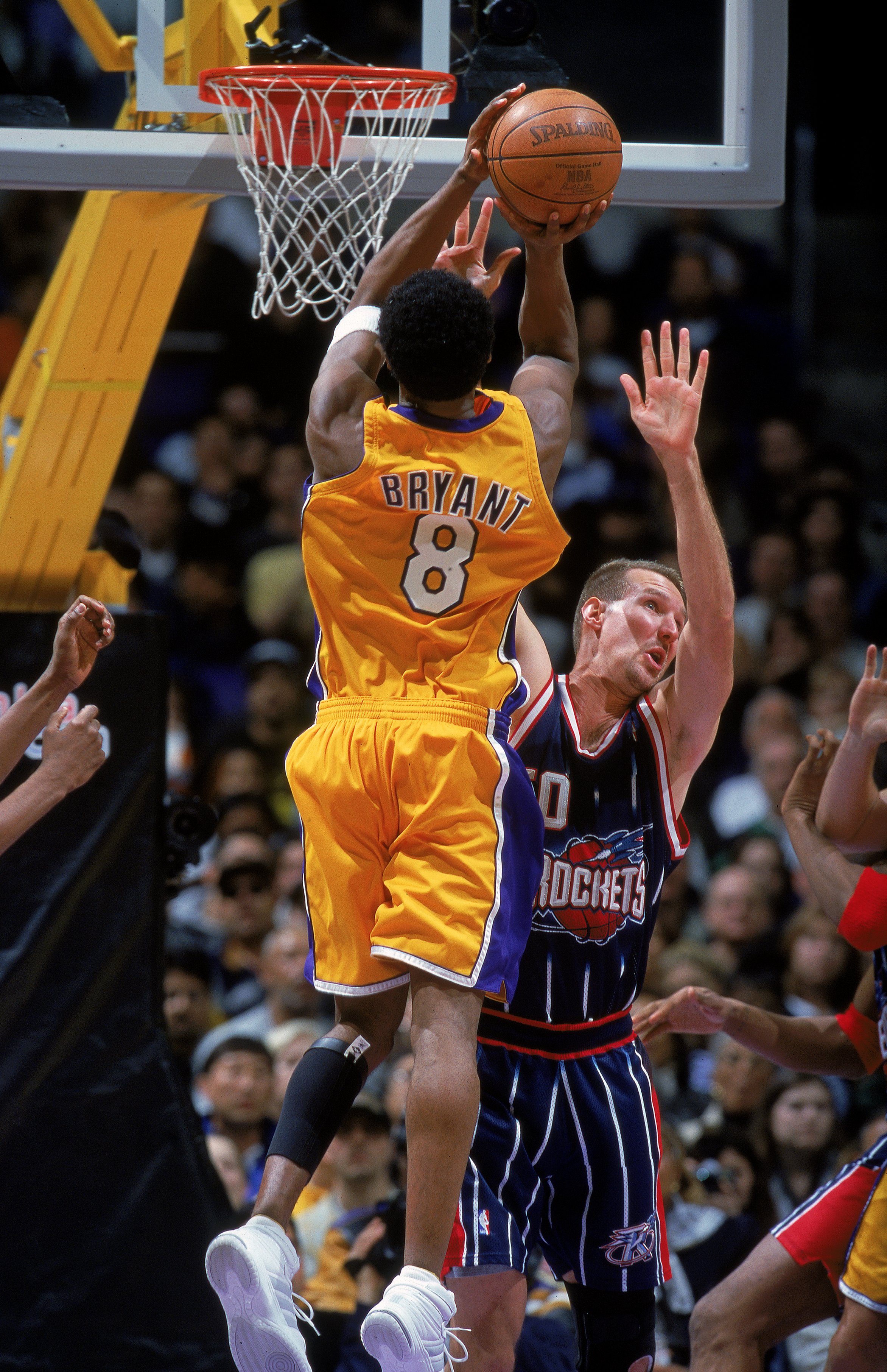 27 Feb 2000: Kobe Bryant #8 of the Los Angeles Lakers makes a jump shot as he is blocked by Matt Bullard #50 of the Houston Rockets at Staples Center in Los Angeles, California. The Lakers defeated the Rockets 101-85.      Mandatory Credit: Tom Hauck  /Al
