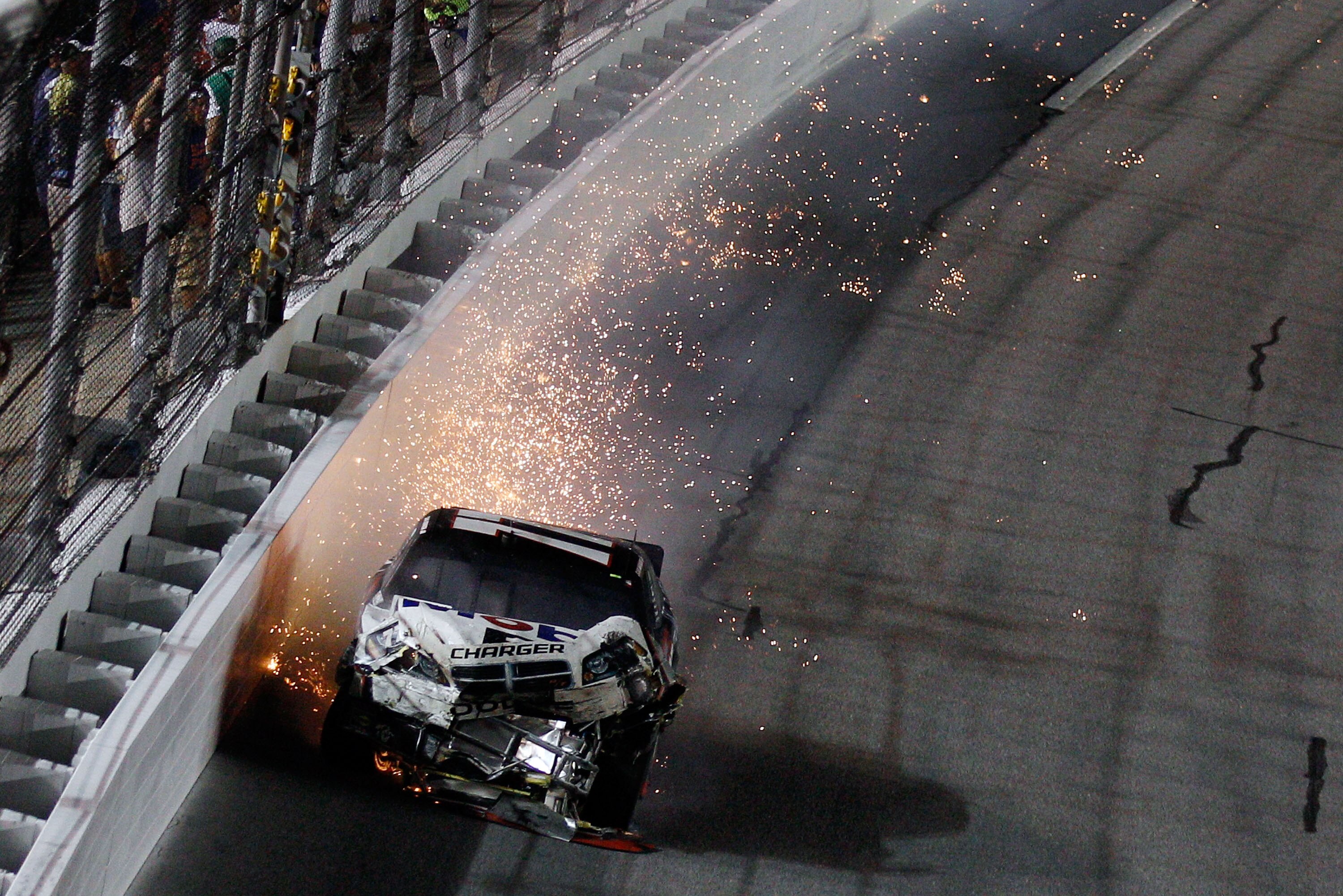DAYTONA BEACH, FL - JULY 03:  Sam Hornish Jr., driver of the #77 Mobil 1 Dodge wrecks during the NASCAR Sprint Cup Series Coke Zero 400 at Daytona International Speedway on July 3, 2010 in Daytona Beach, Florida.  (Photo by Chris Graythen/Getty Images)