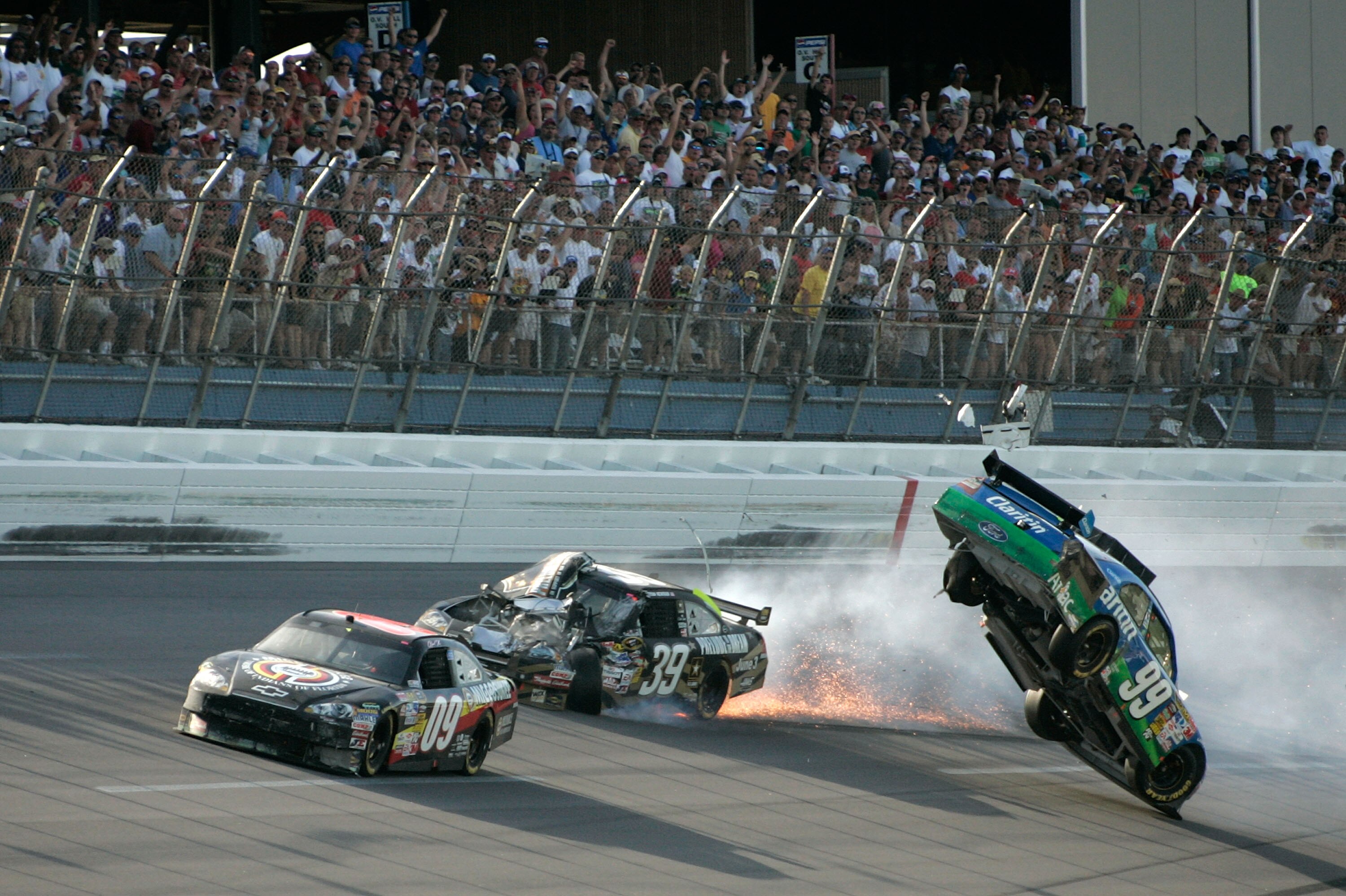 TALLADEGA, AL - APRIL 26:  Carl Edwards, driver of the #99 Claritin Ford, goes airborne as Ryan Newman, driver of the #39 Steweart-Haas Racing Chevrolet suffers damage and Brad Keselowski, driver of the #09 Miccosukee Indian Gaming Chevrolet drives at the