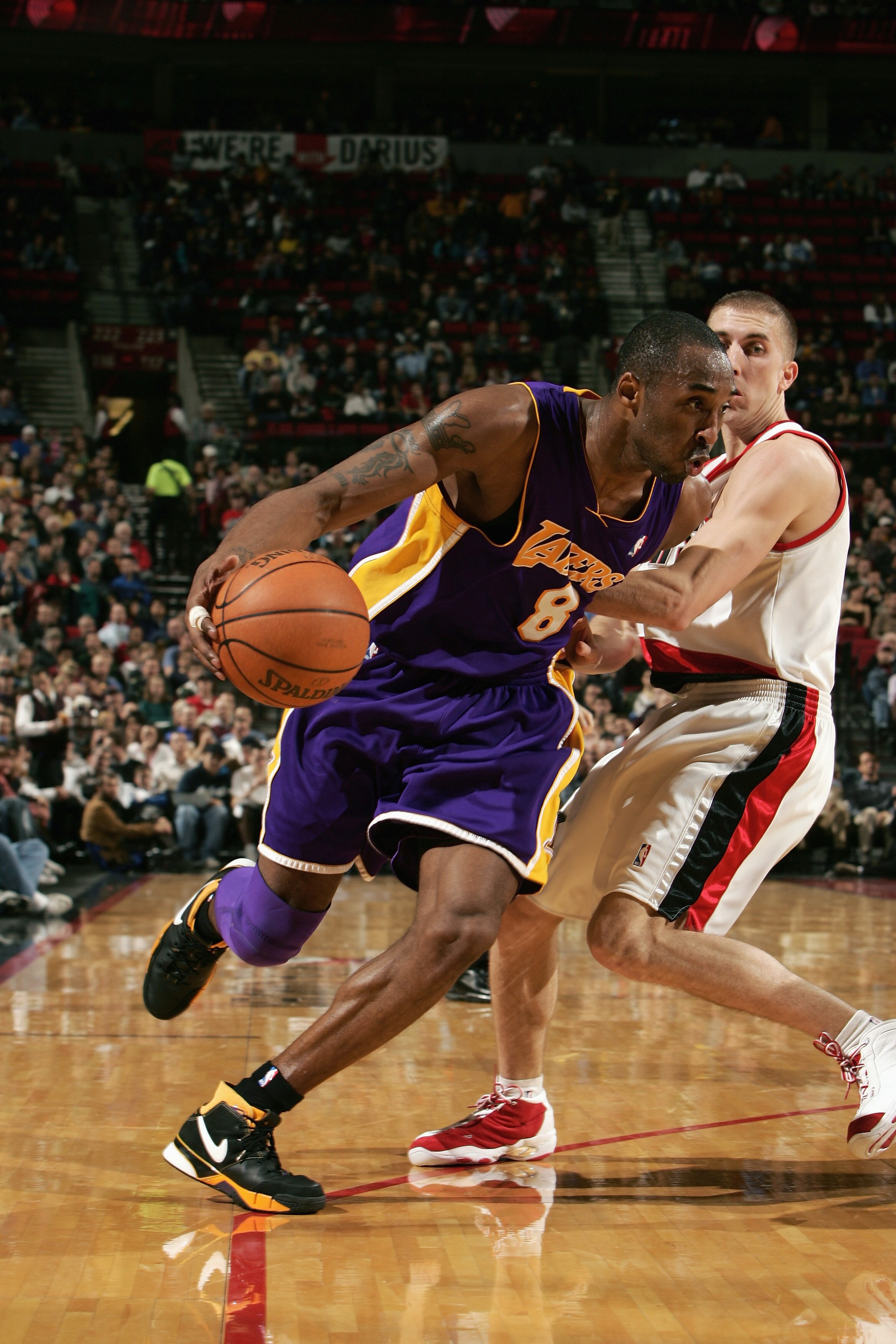 PORTLAND, OR - JANUARY 11:  Kobe Bryant #8 of the Los Angeles Lakers drives against Steve Blake #2 of the Portland Trail Blazers  on January 11, 2006 at The Rose Garden in Portland, Oregon. The Blazers won 113-103. (Photo by Jonathan Ferrey/Getty Images)