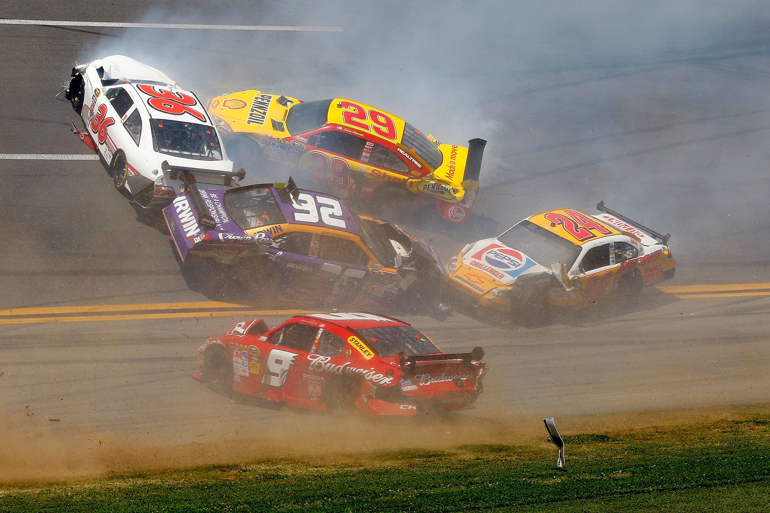 TALLADEGA, AL - APRIL 26:  Scott Riggs, driver of the #36 Tommy Baldwin Racing Toyota, Kevin Harvick, driver of the #29 Shell/Pennzoil Chevrolet, Jamie McMurray, driver of the #26 Crown Royal Ford, Jeff Gordon, driver of the #24 Dupont/Pepsi Chevrolet, an