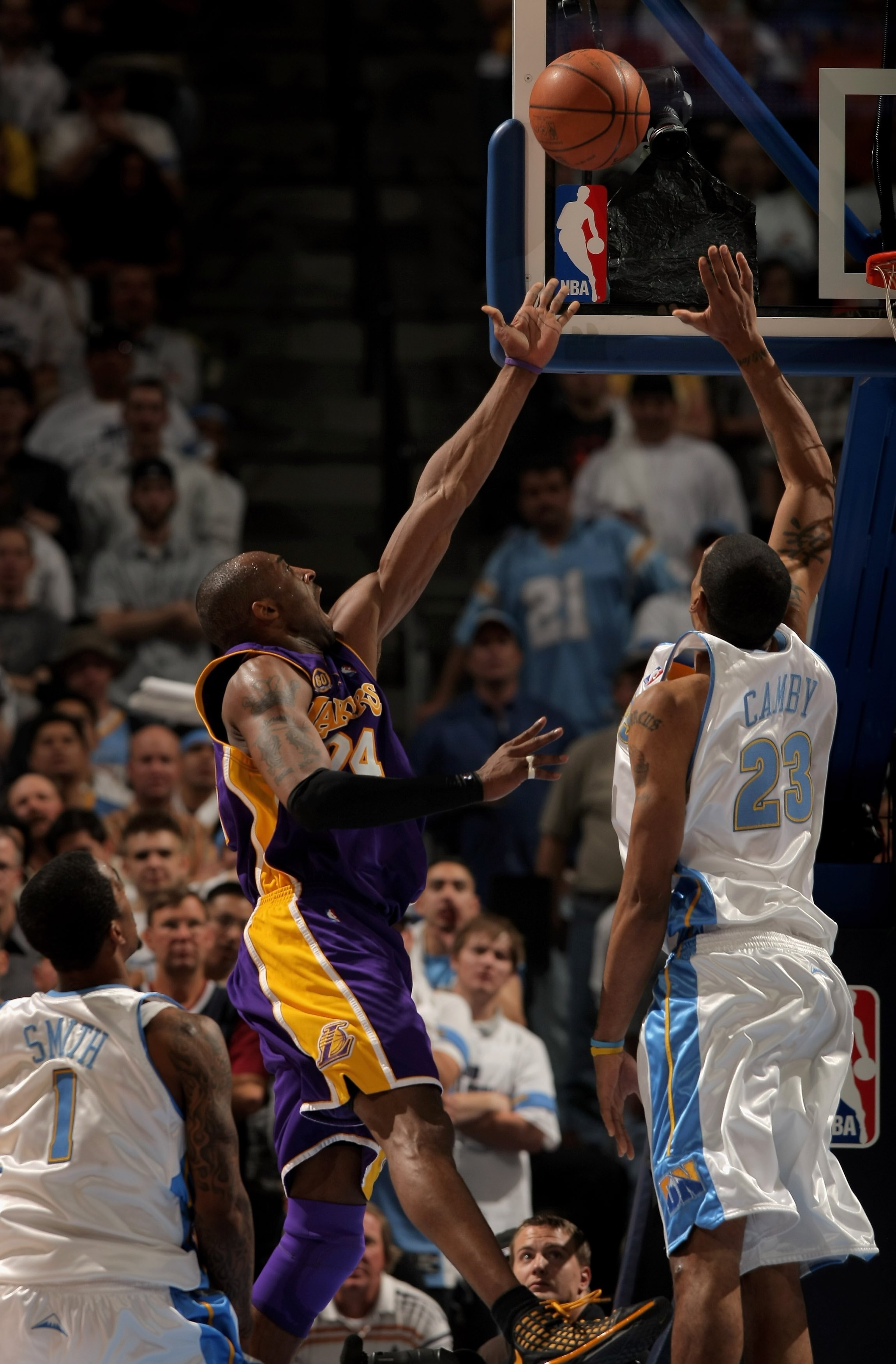 DENVER - APRIL 28:  Kobe Bryant #24 of the Los Angeles Lakers lays up a shot against Marcus Camby #23 the Denver Nuggets in Game Four of the Western Conference Quarterfinals during the 2008 NBA Playoffs at the Pepsi Center on April 28, 2008 in Denver, Col