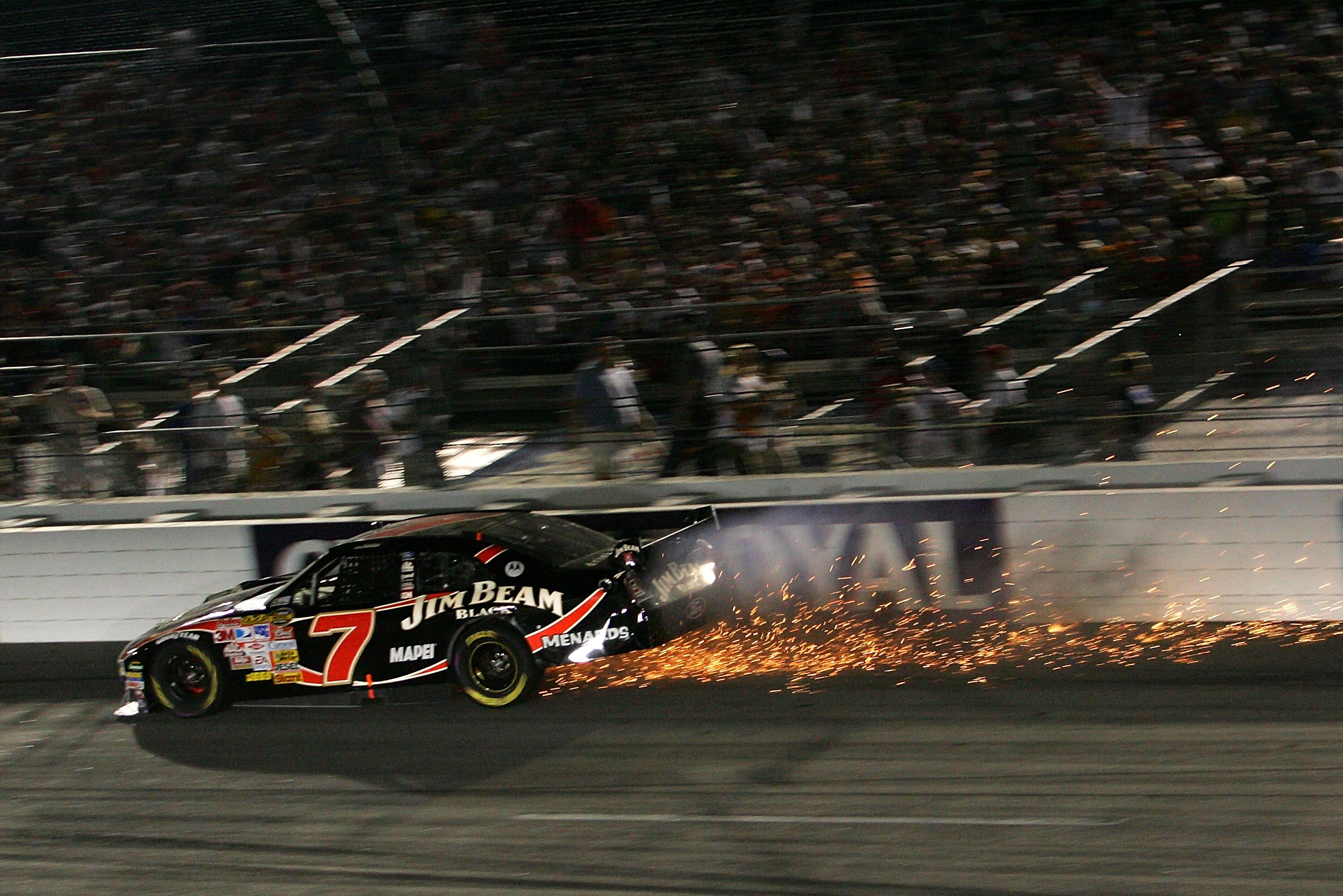 RICHMOND, VA - SEPTEMBER 08: Robby Gordon, driver of the #7 Jim Beam Black Chevrolet, crashes into the wall during the NASCAR Nextel Cup Series Chevy Rock & Roll 400 at Richmond International Raceway on September 8, 2007 in Richmond, Virginia.  (Photo by