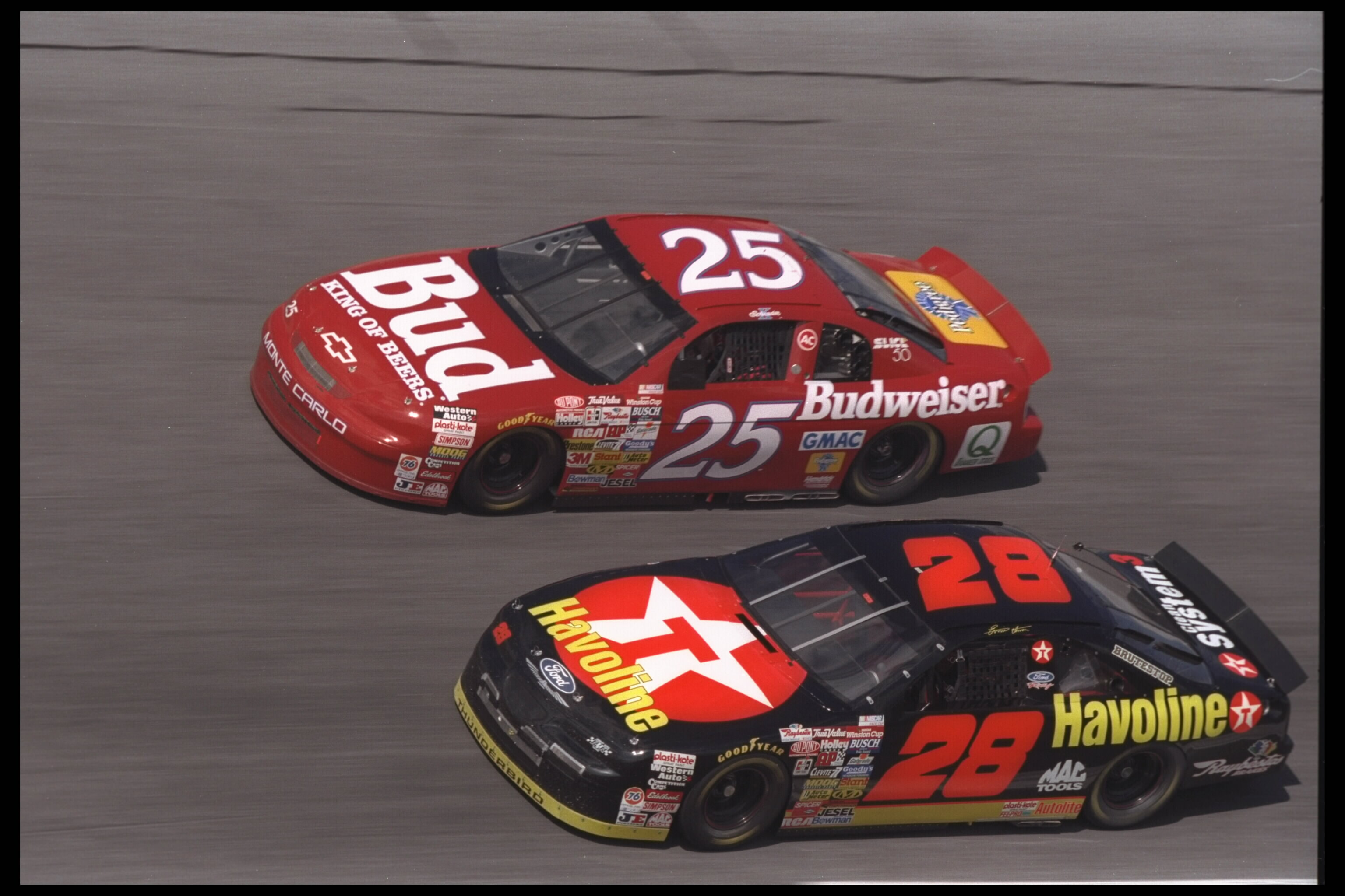 15 Feb 1996: Nascar drivers Ken Schrader #25 and Ernie Irvan #28 race side by side during the Daytona 500 in Daytona Beach, Florida. Dale Jarrett finished first in front of Dale Earnhardt. Schrader finished third and Irvan 35th.